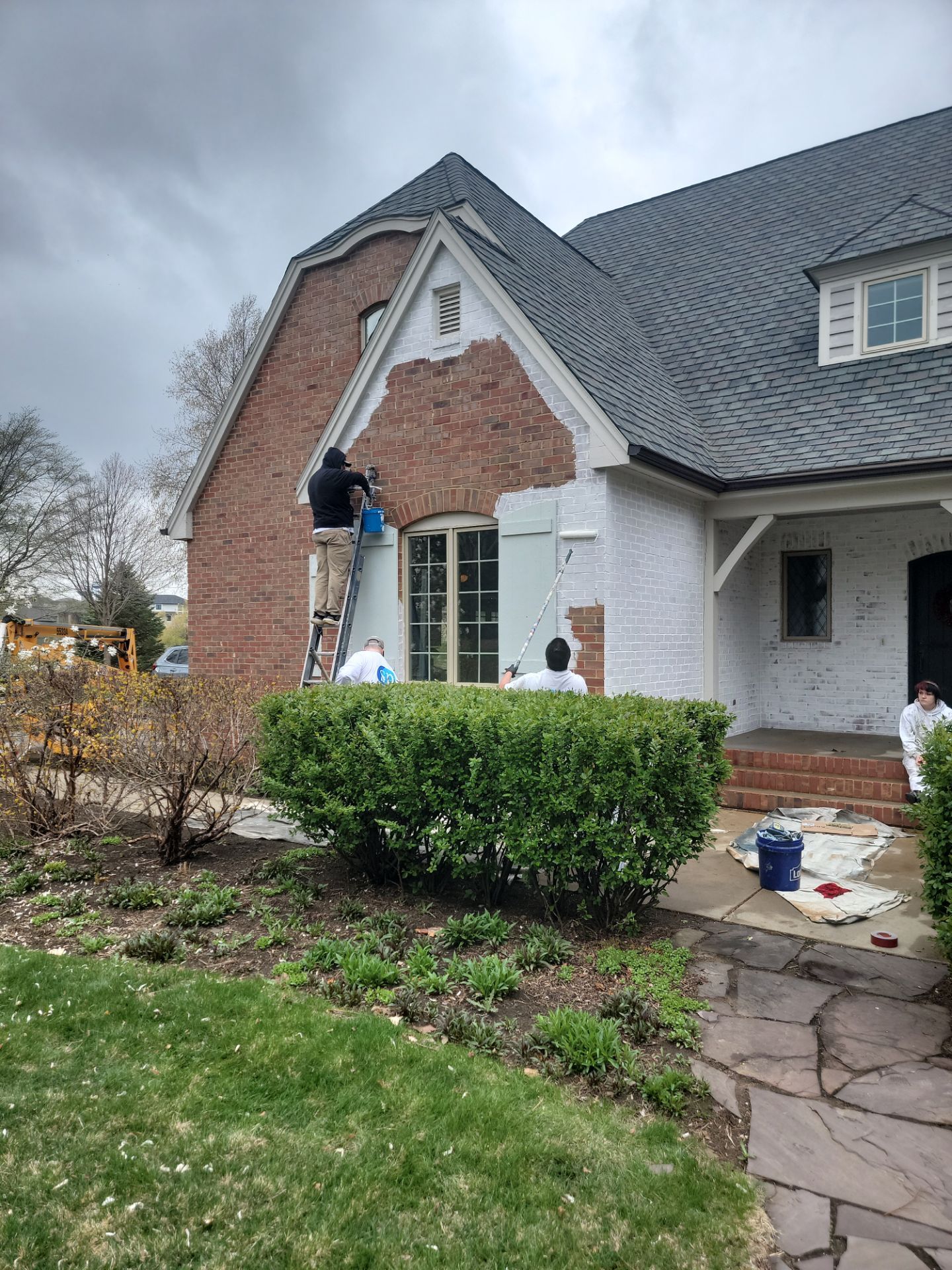 Residential Exterior Brick Painting and Limewash Refresh in Sioux Falls by Select Painting, Coatings & Garage Cabinets