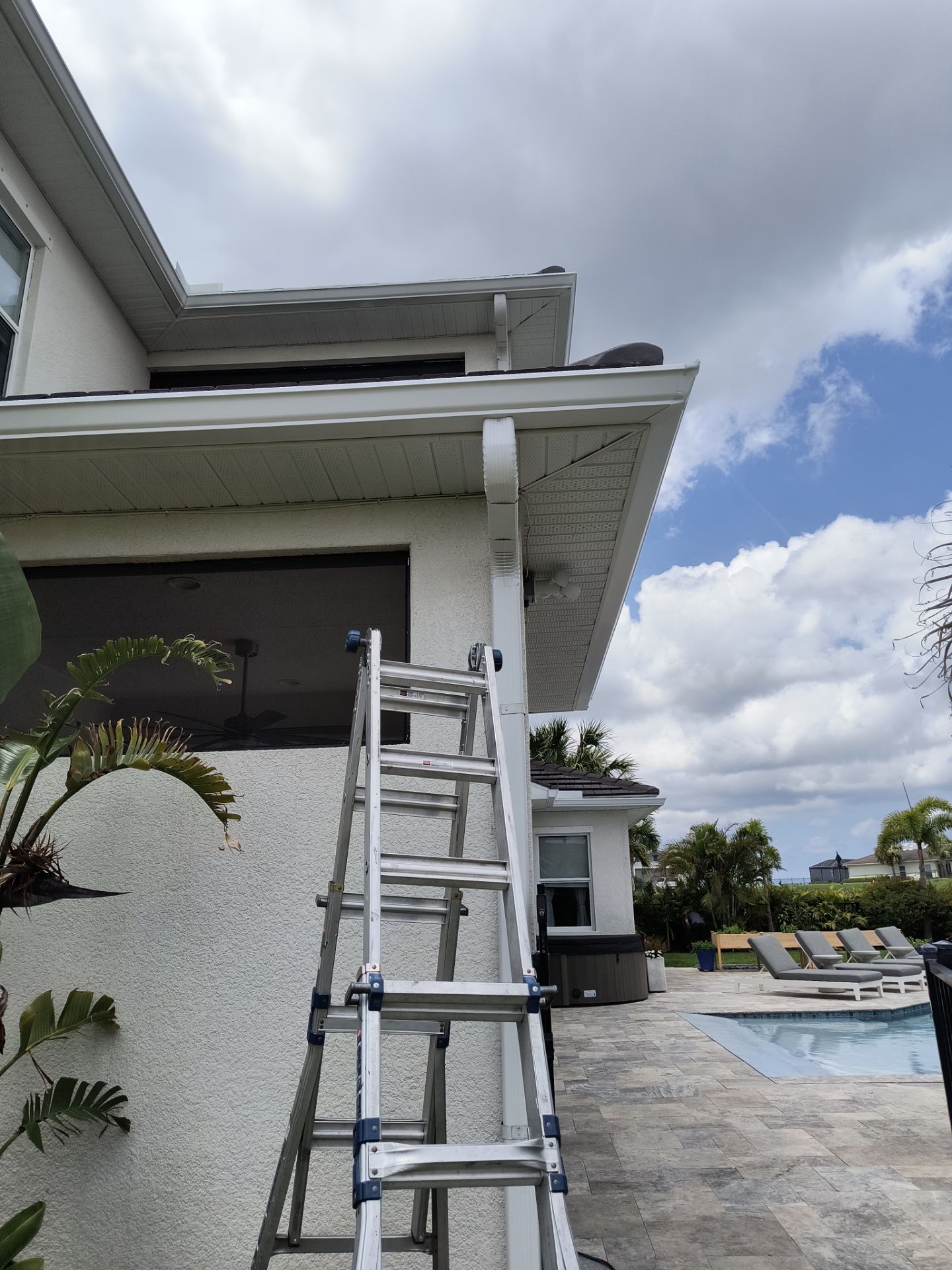 White Seamless Gutters with Downspouts in Bradenton FL by Gutter Professors