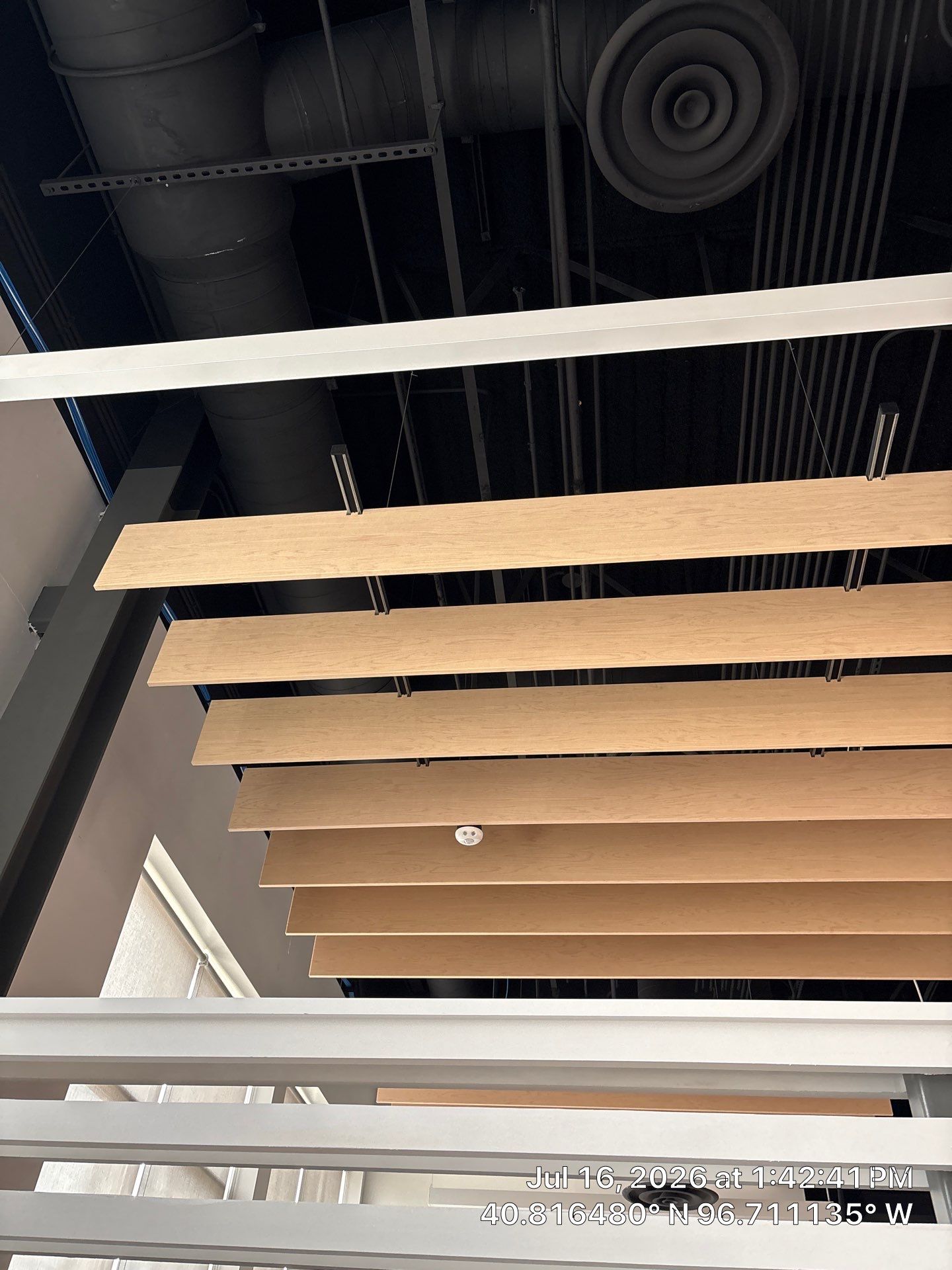 Commercial Office Interior Upgrades Featuring Linear Wood Ceiling Baffles by CompanyCam Sales Demo
