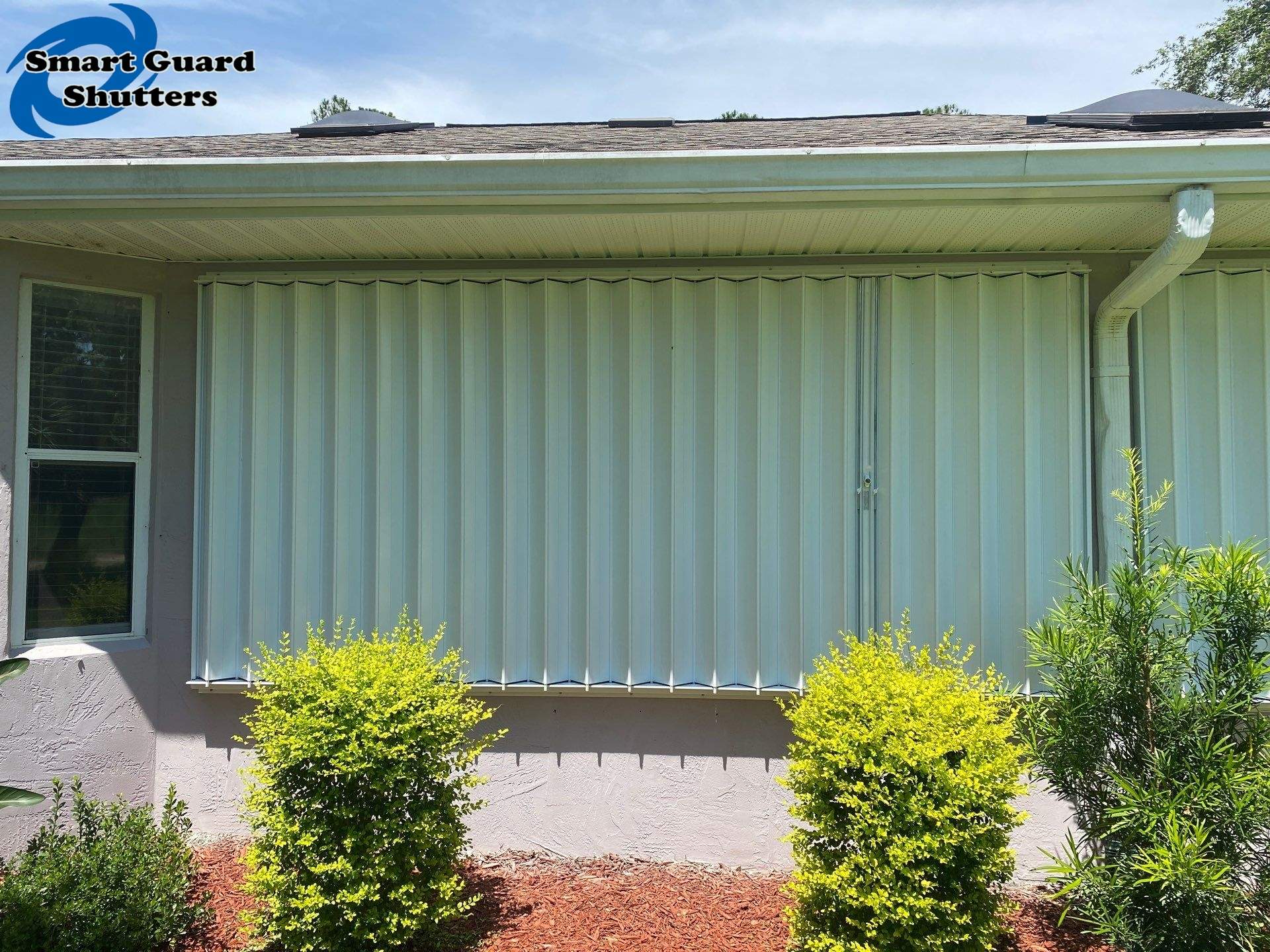 Accordion Shutters in White by Smart Guard Shutters