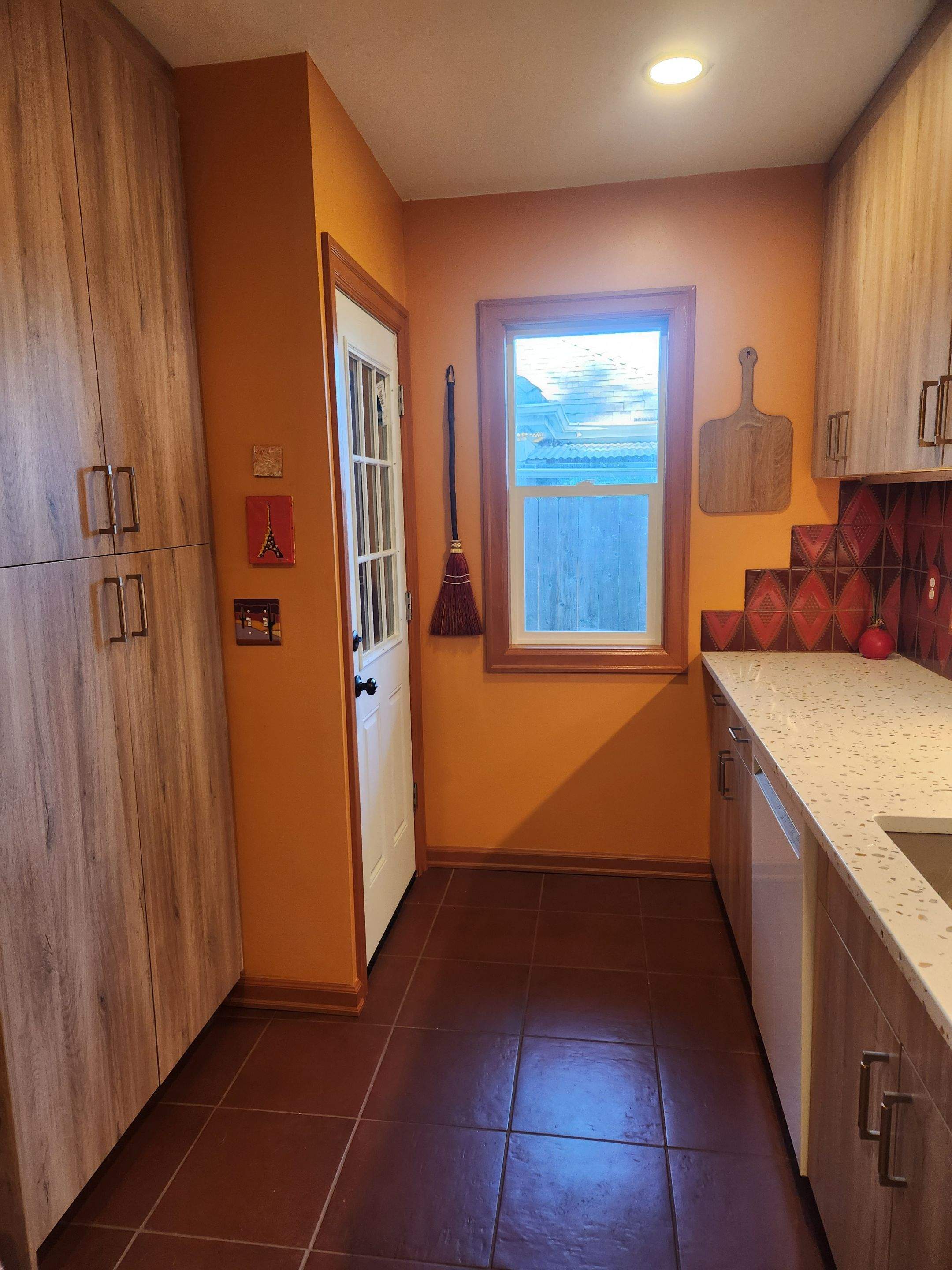 Complete Kitchen Remodeling Featuring Terracotta Tile and Wood Cabinetry by American Made Construction 