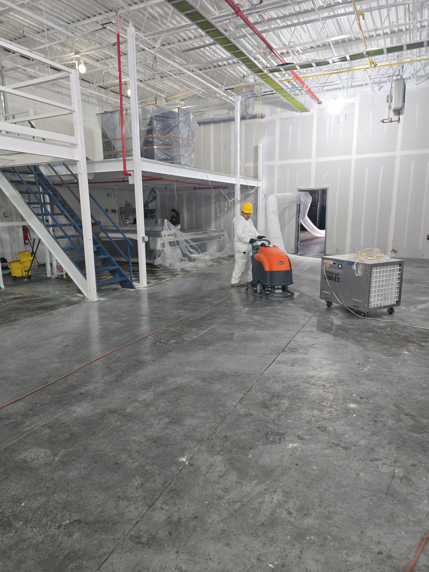 Industrial Warehouse Fire Damage Cleaning and Spray Sealing in Islandia by EMS Restoration Corp