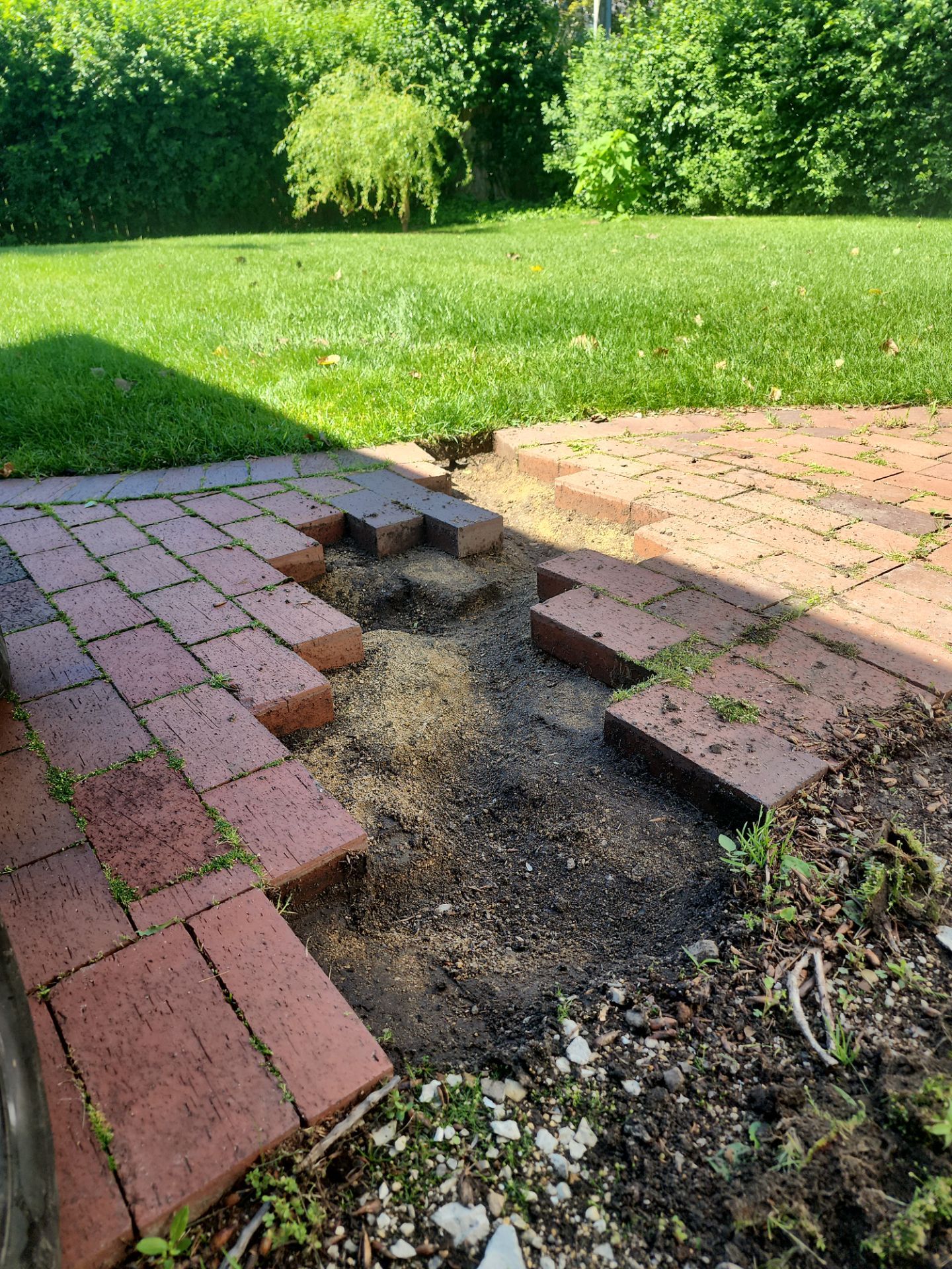 Brick paver repair, cleaning and sealing by Northern Power Washing LLC.