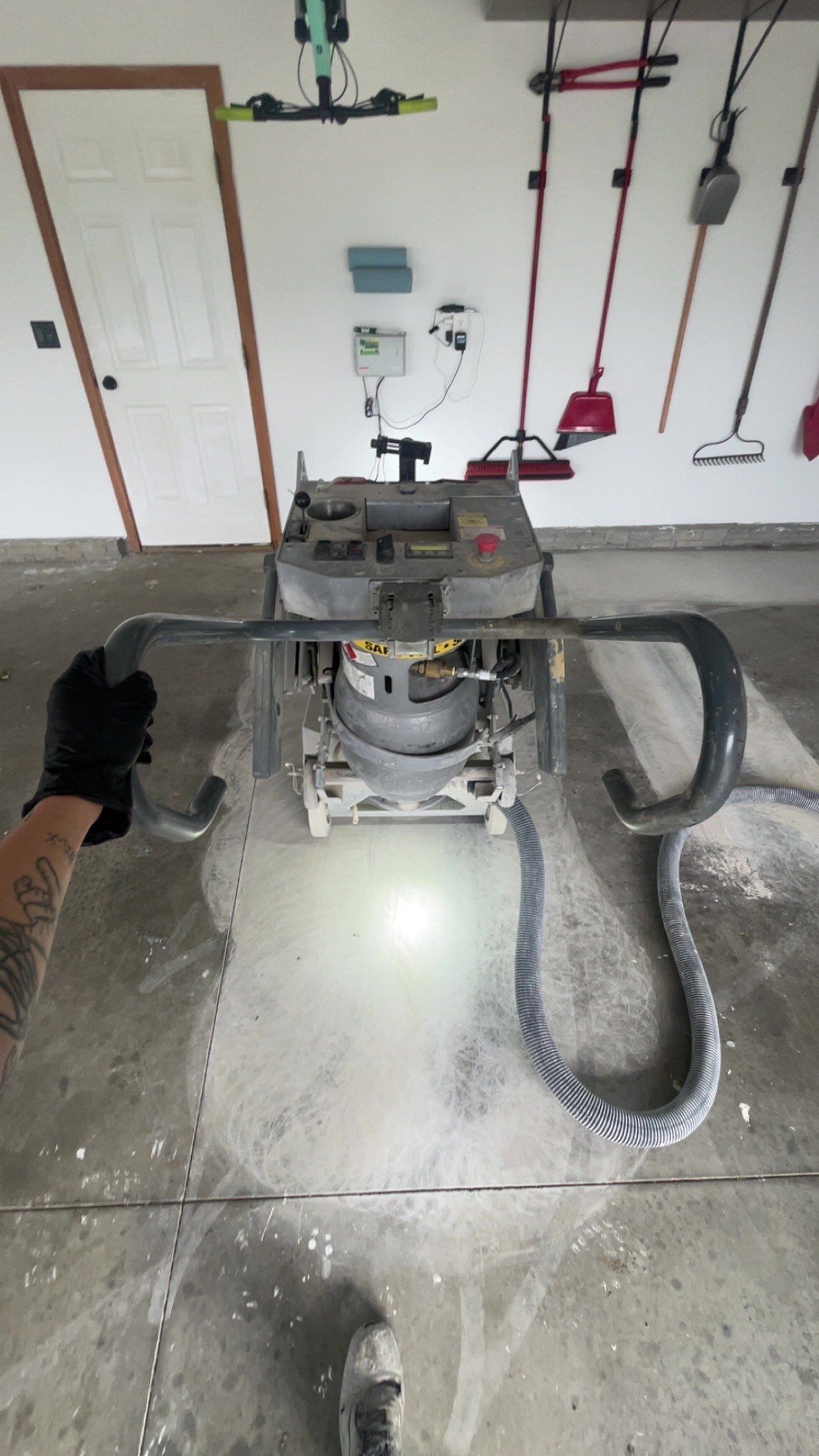 Tidal Wave Flake Garage Floor Installation in Sioux Falls by Select Painting, Coatings & Garage Cabinets