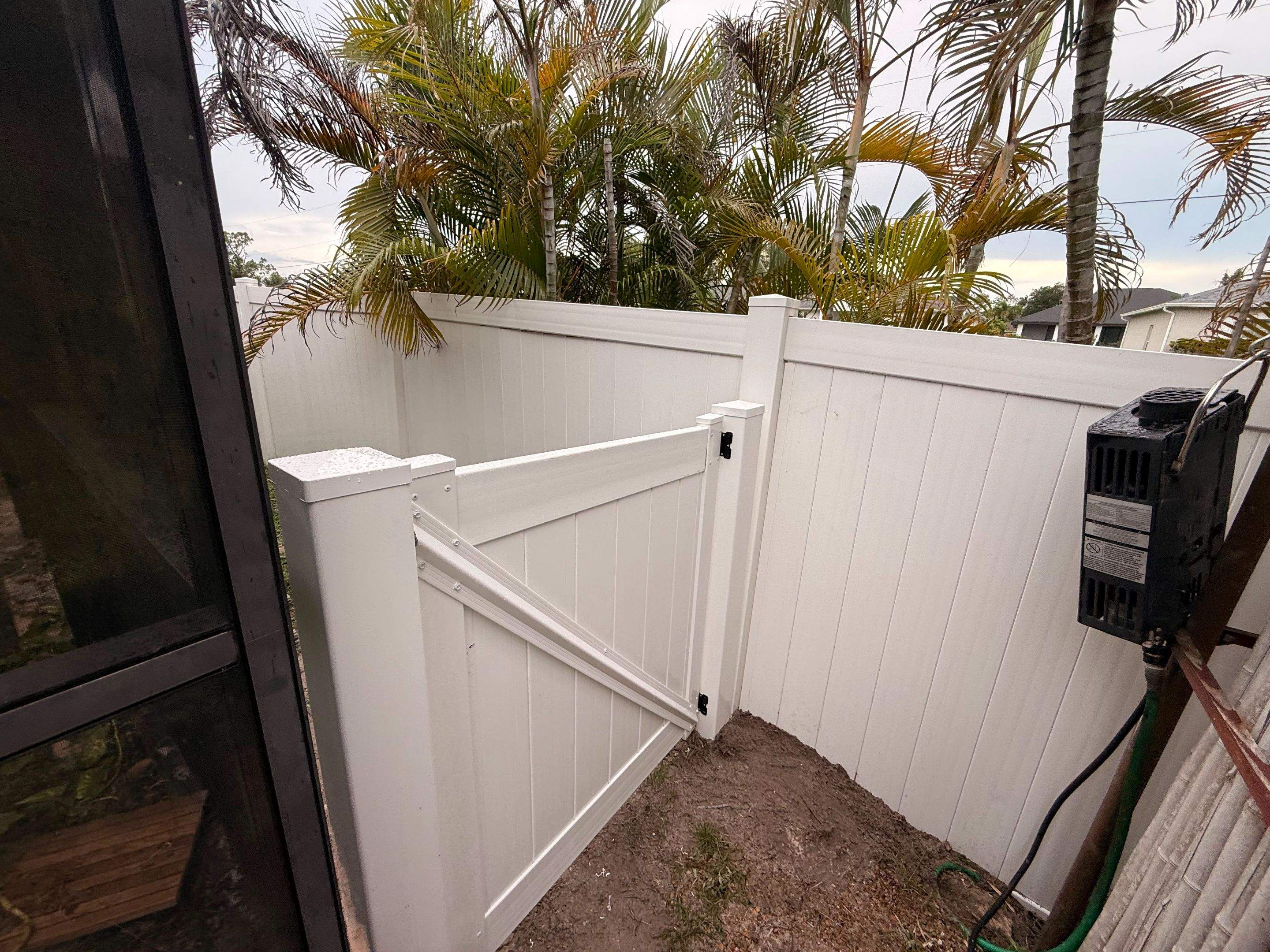 Vinyl Privacy Fence and Double Gate Installation in North Port by True Fence LLC