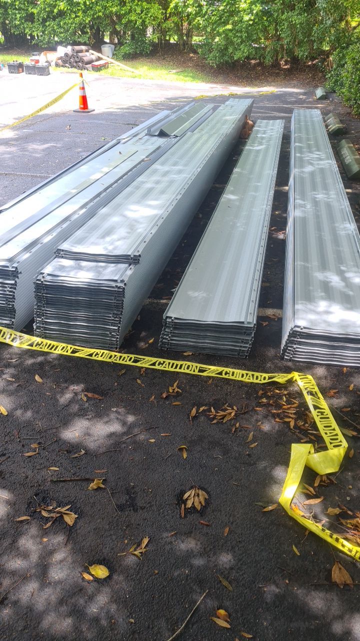 Commercial Roofing Installation using 1" Nail strip metal roof by BLUES BROTHERS ROOFING