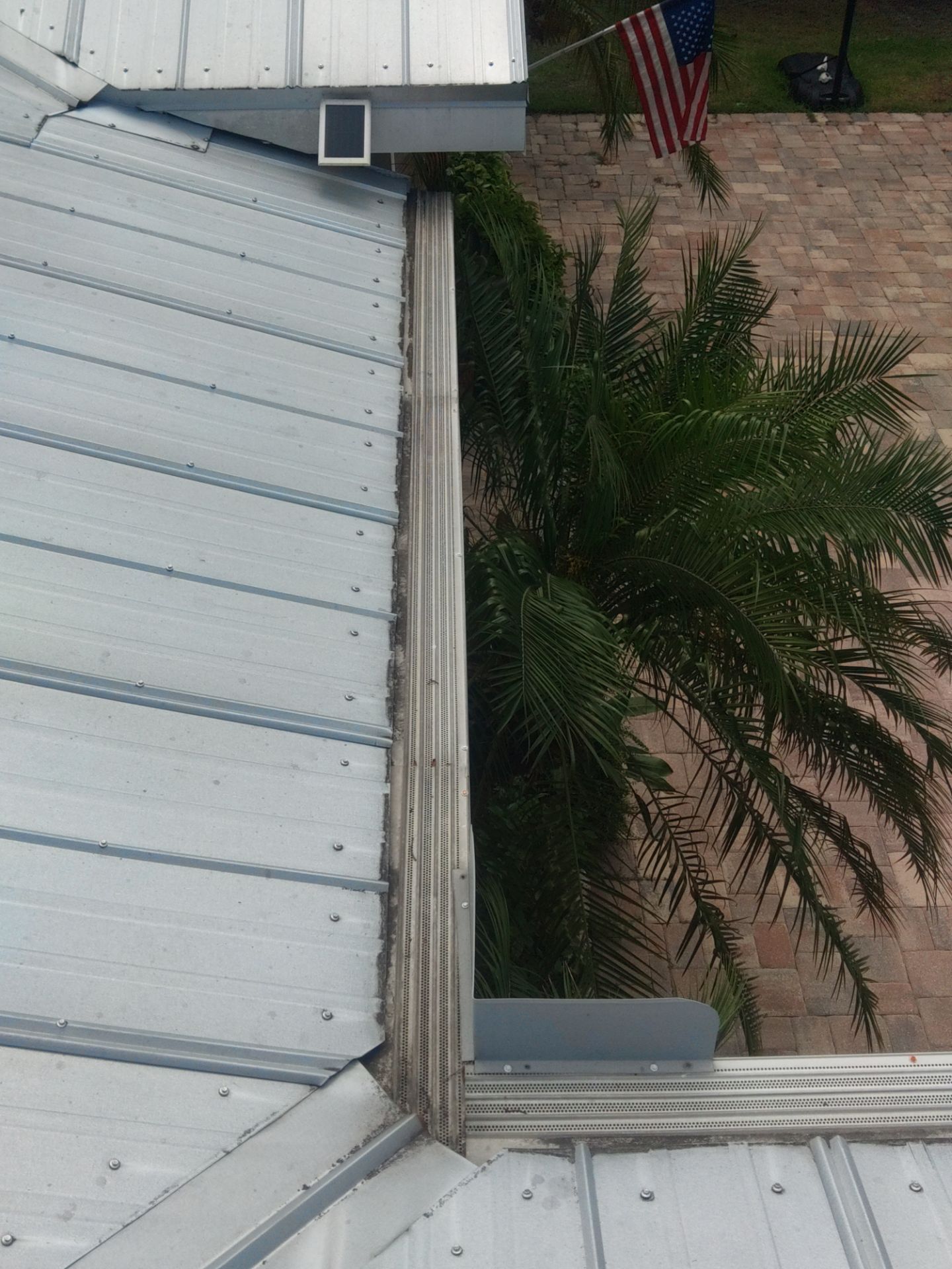 Gutter guards installation combined with gutter cleaning in Sarasota, FL by Gutter Professors