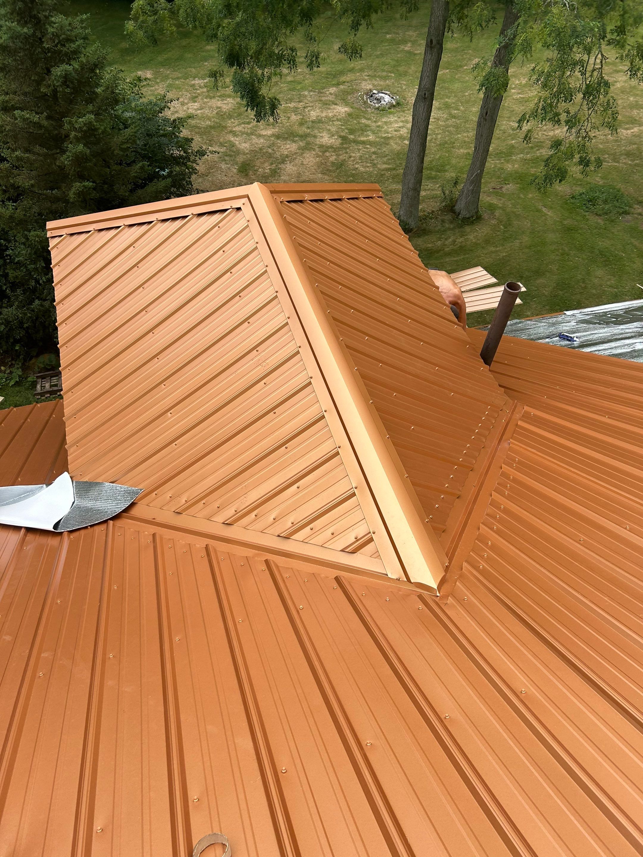 Residential Roofing Installation using Performance Panel Metal - Copper Metallic by RoofX 