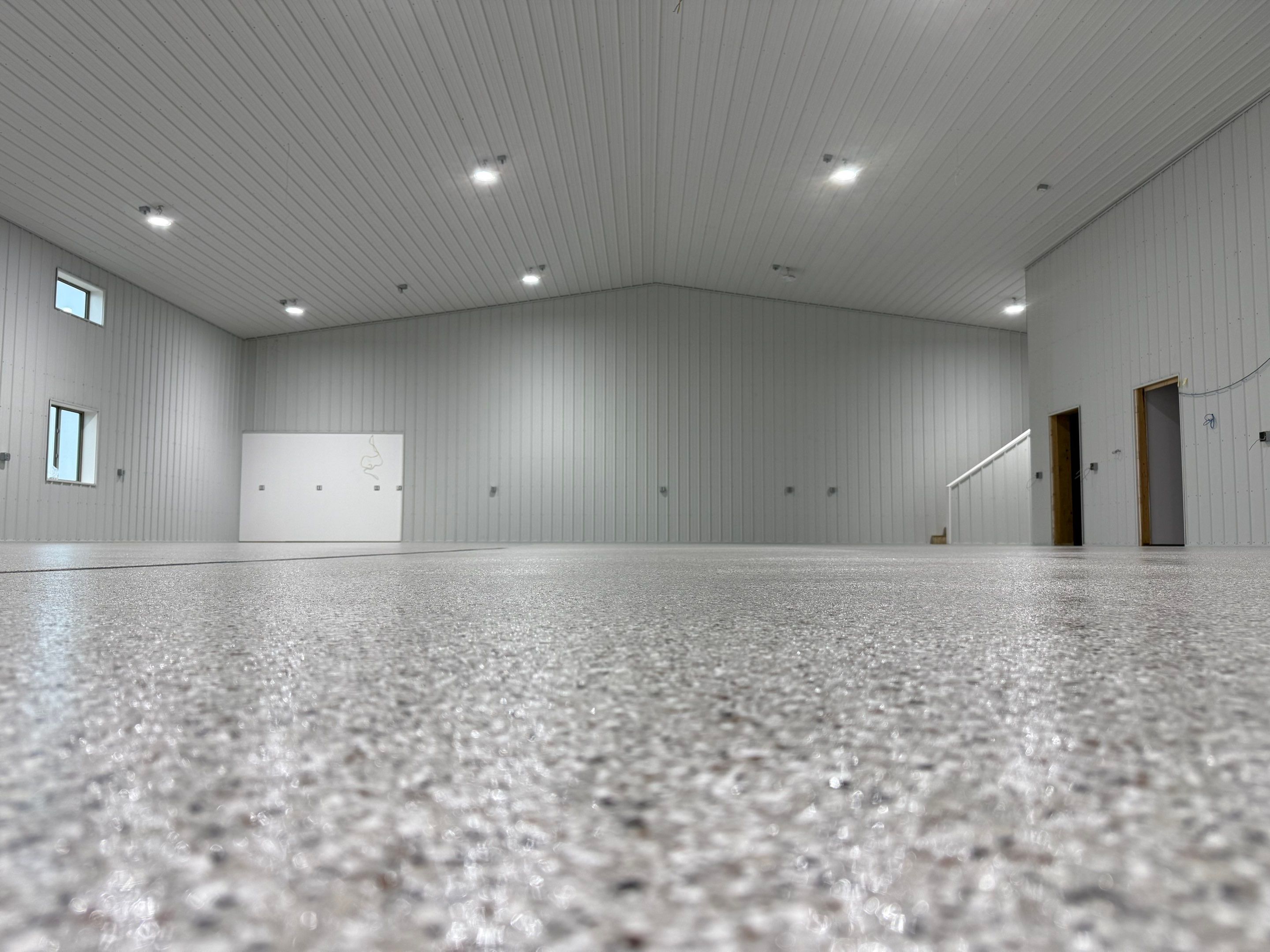 Custom Speckled Floor Coating for Large Montrose Shop by Select Painting, Coatings & Garage Cabinets