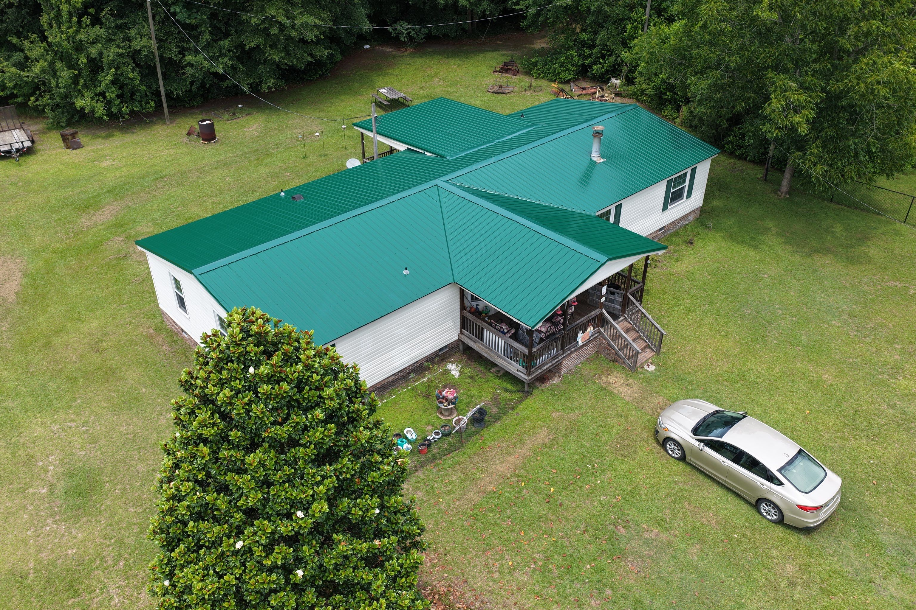 Standing Seam Green Metal Roof Installation in Sumter by Exterior Genie, LLC