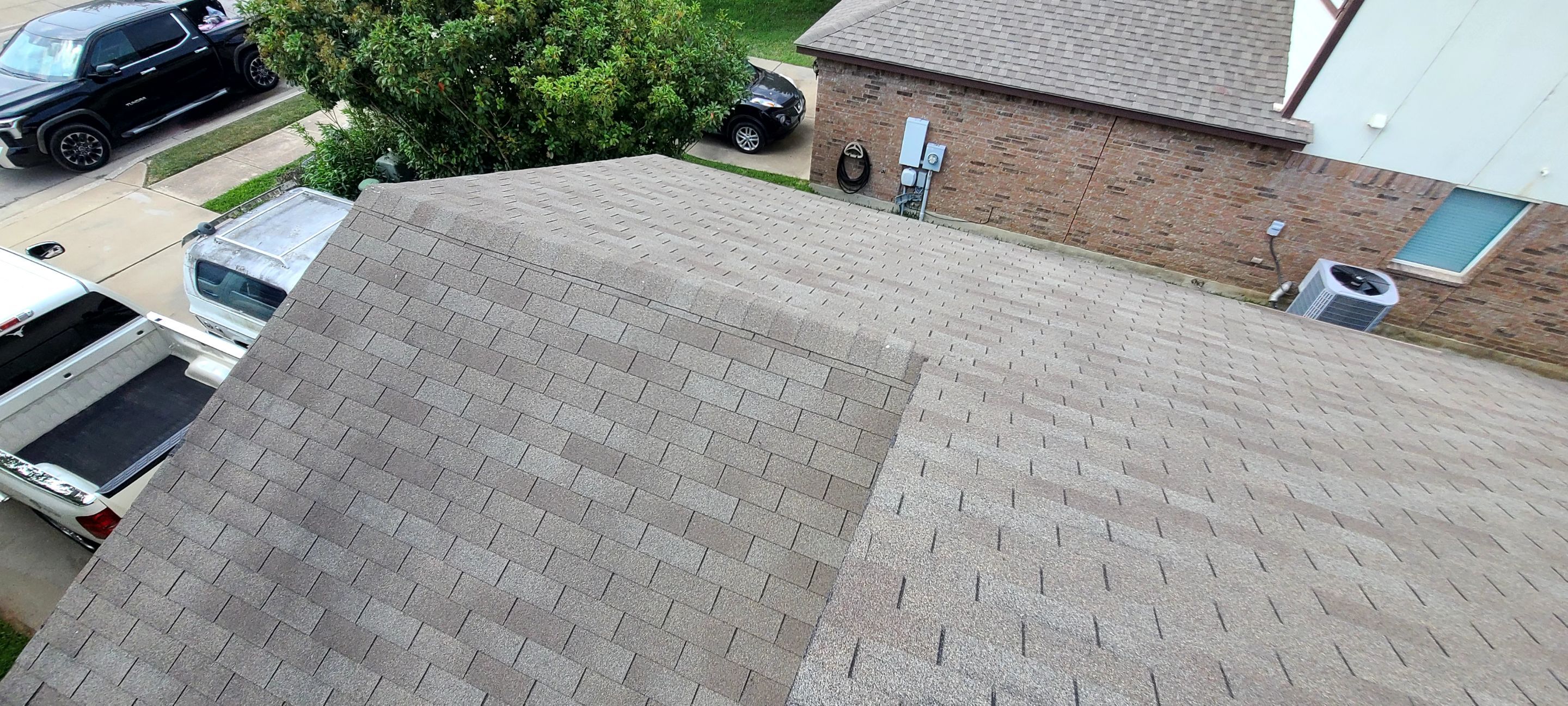 Asphalt Shingle Roof Replacement and Window Glazing in Manor by Caliber Restoration LLC
