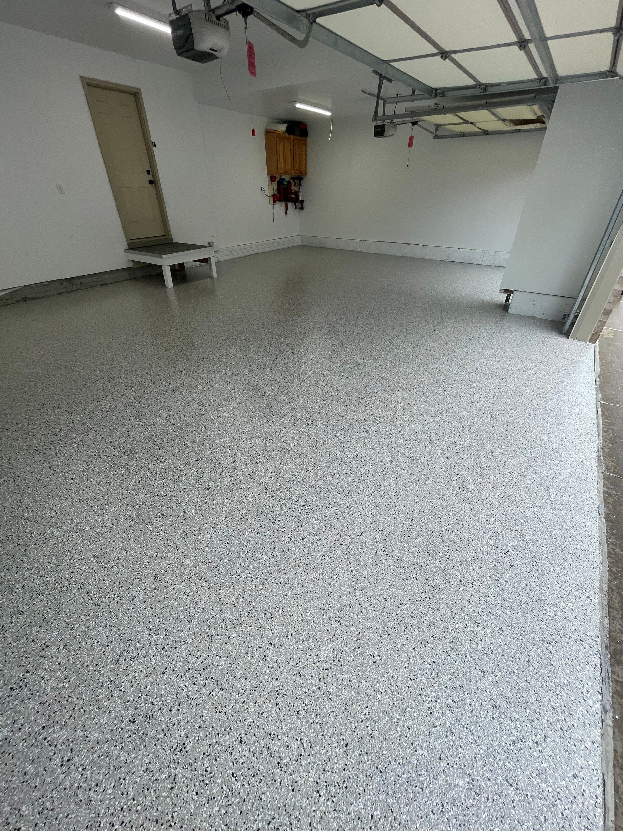 Cabin Fever Garage Floor System in Sioux Falls by Select Painting, Coatings & Garage Cabinets
