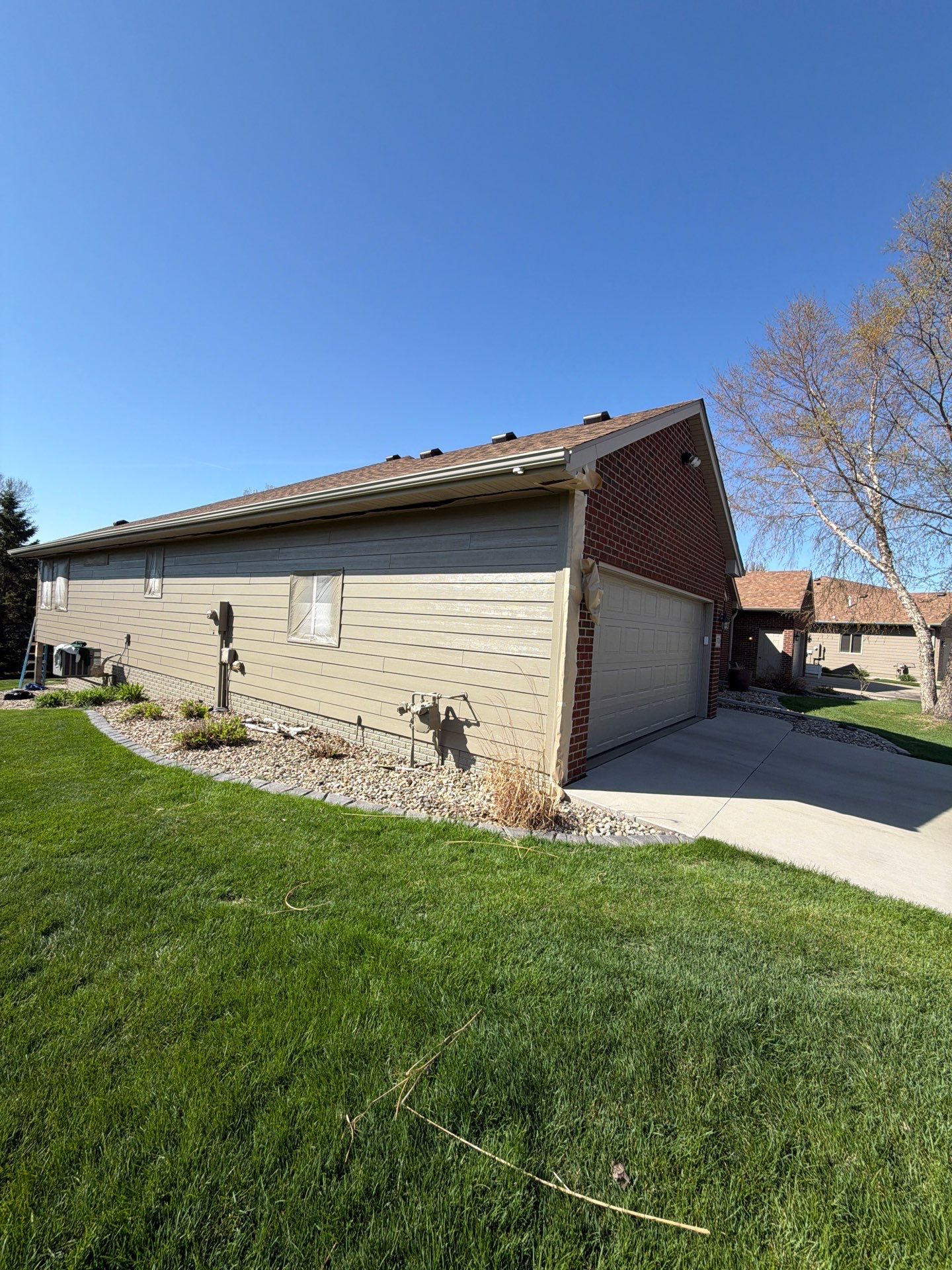 Residential Exterior Siding and Trim Painting in Sioux Falls by Select Painting, Coatings & Garage Cabinets