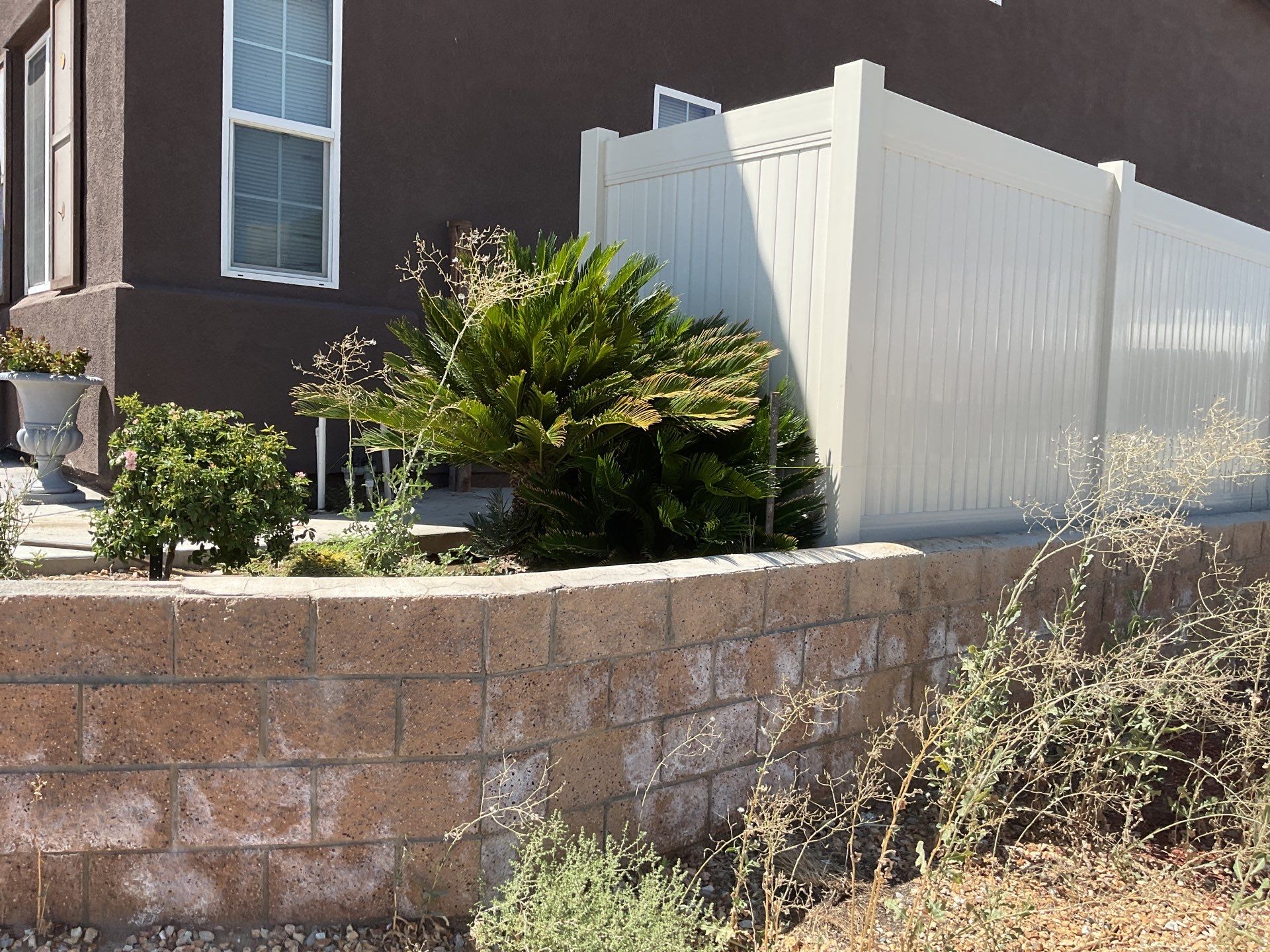 Tan Vinyl by Fence Guys Inc. 