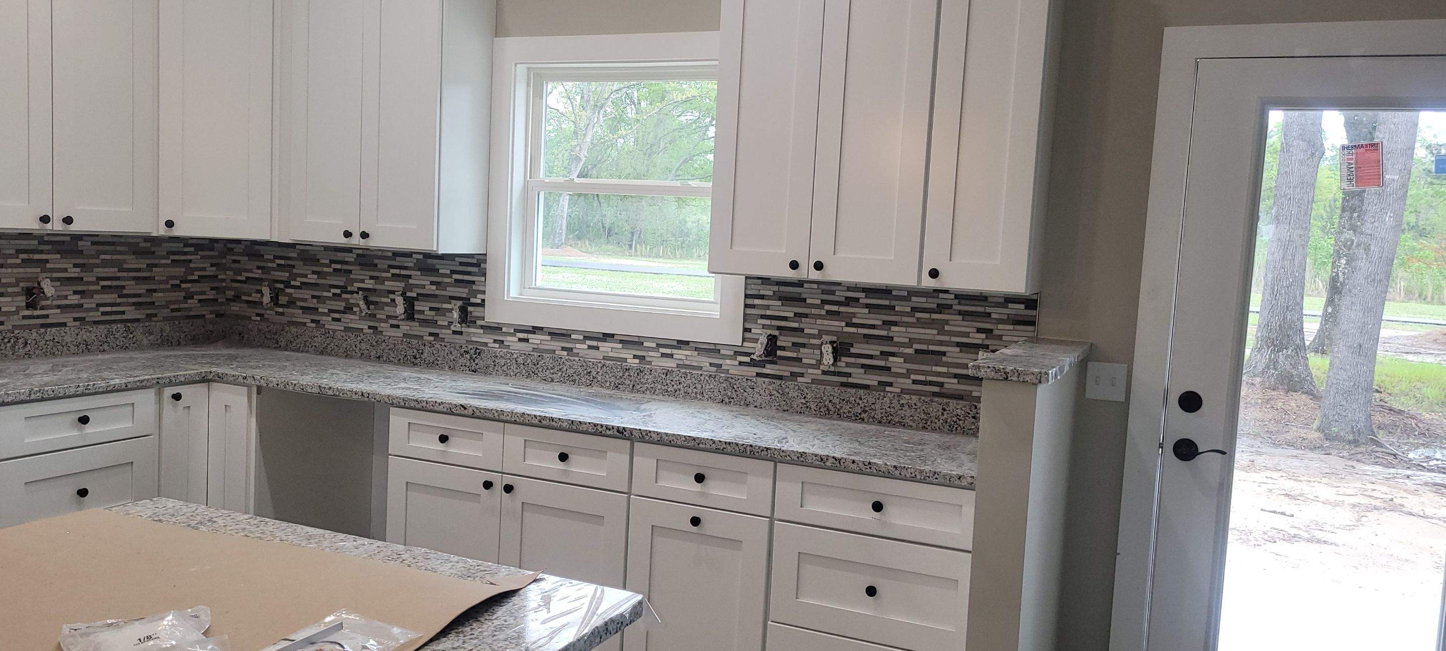 New Home Construction using brick and vertical vinyl by Cornerstone Home Builders, LLC