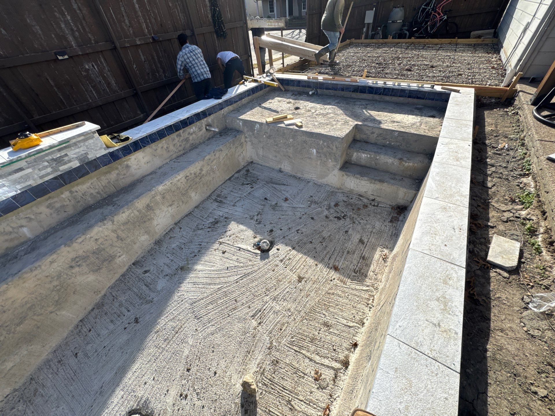 Pool with Turf and Raised Wall by Pinnacle Pools and Spas - DFW