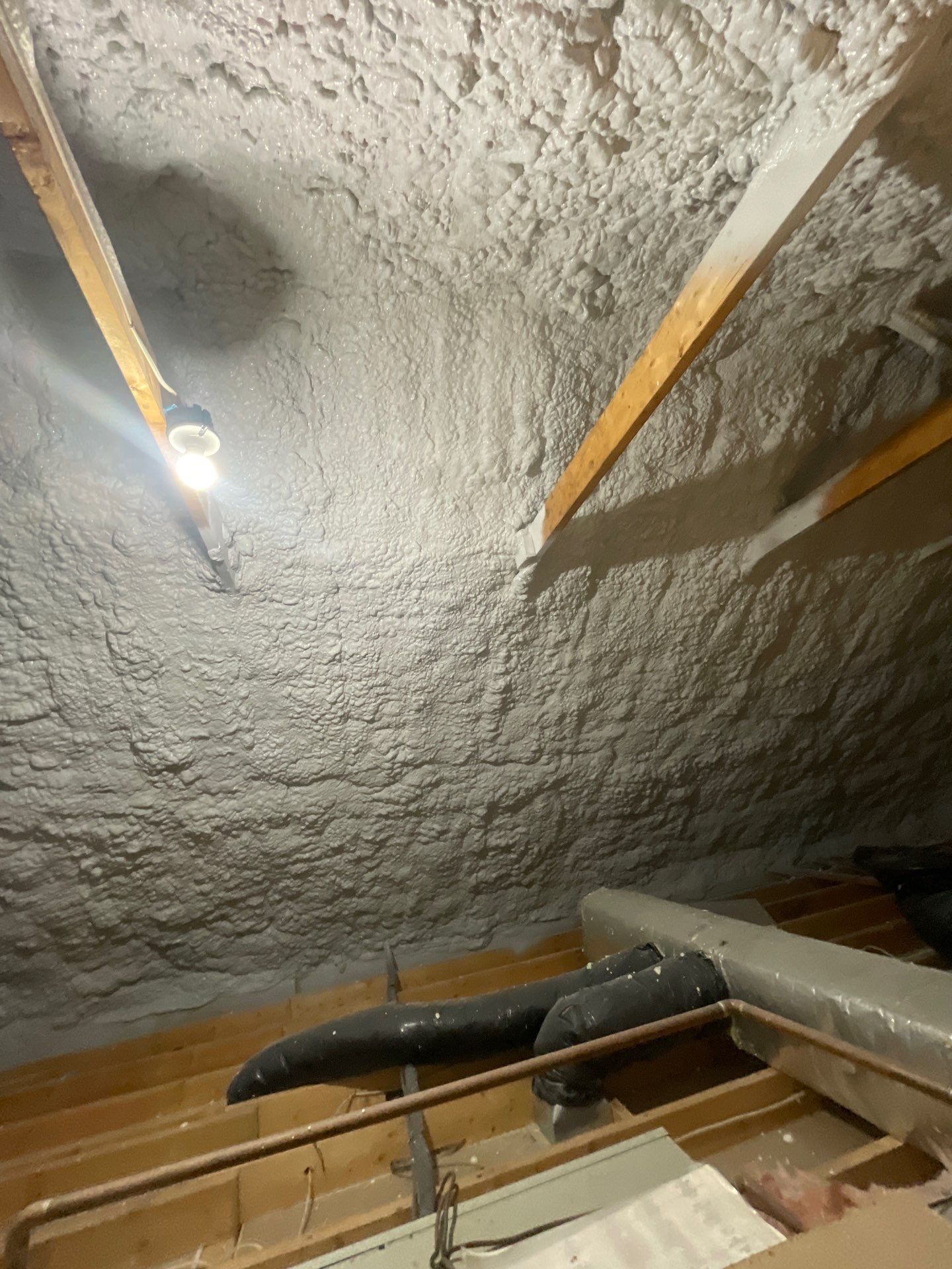 Attic Insulation using open cell spray foam by NYS Foam & Energy