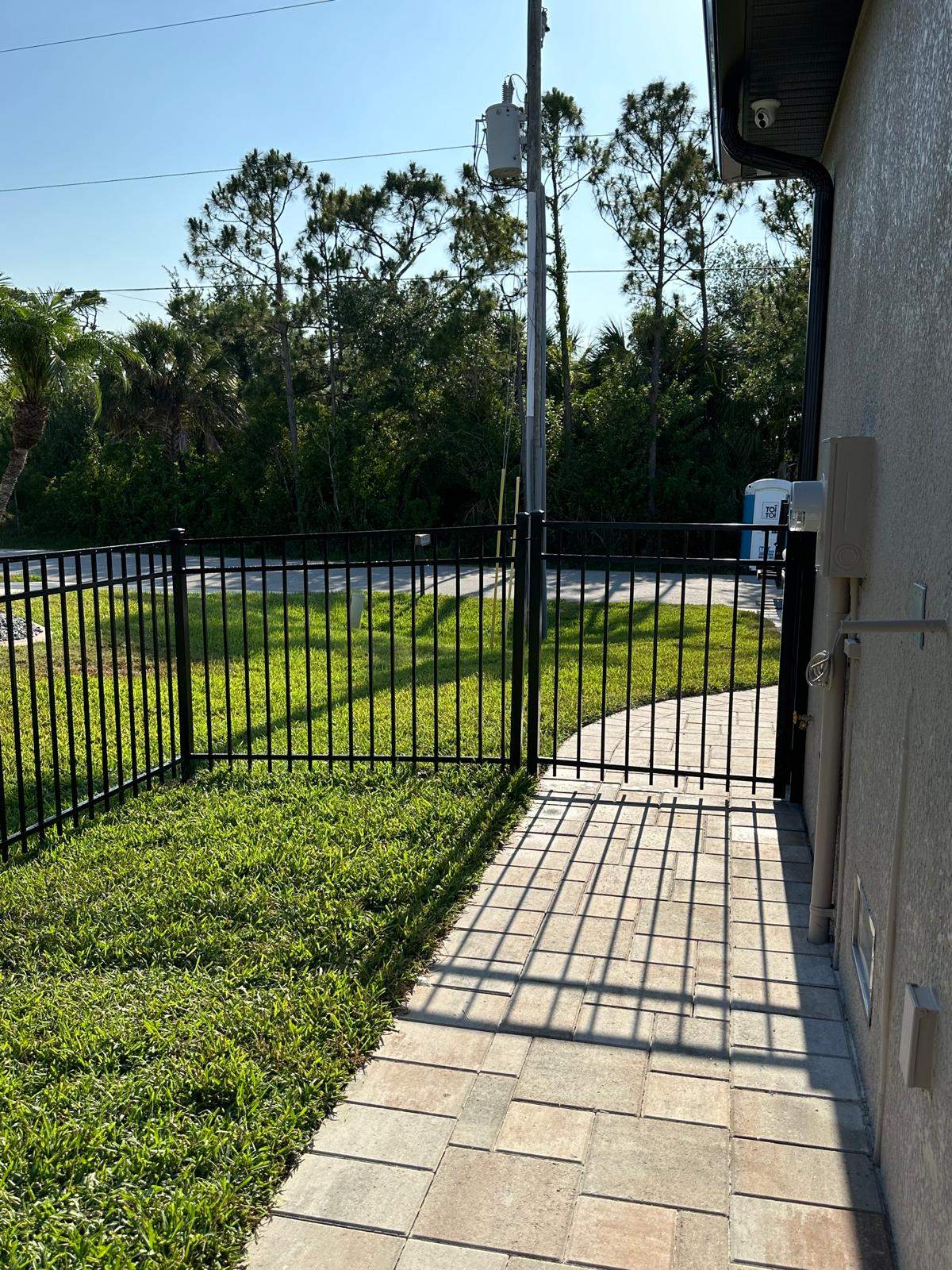 Waterfront Black Aluminum Fence Installation in Port Charlotte by True Fence LLC