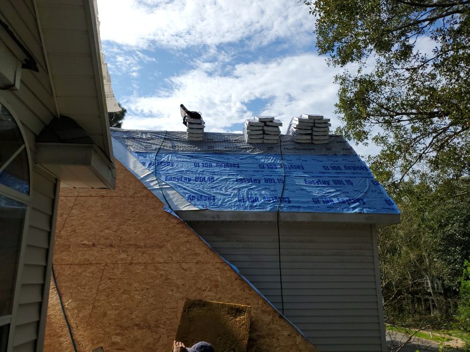 Residential Roofing Installation using Roof Replacement by American Roofing & Construction LLC