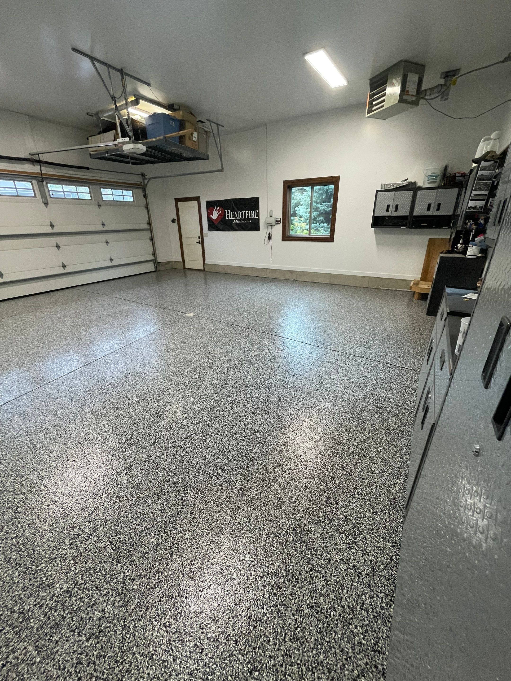 Garage Floor Coating and Domino Flake Finish in Sioux Falls by Select Painting, Coatings & Garage Cabinets