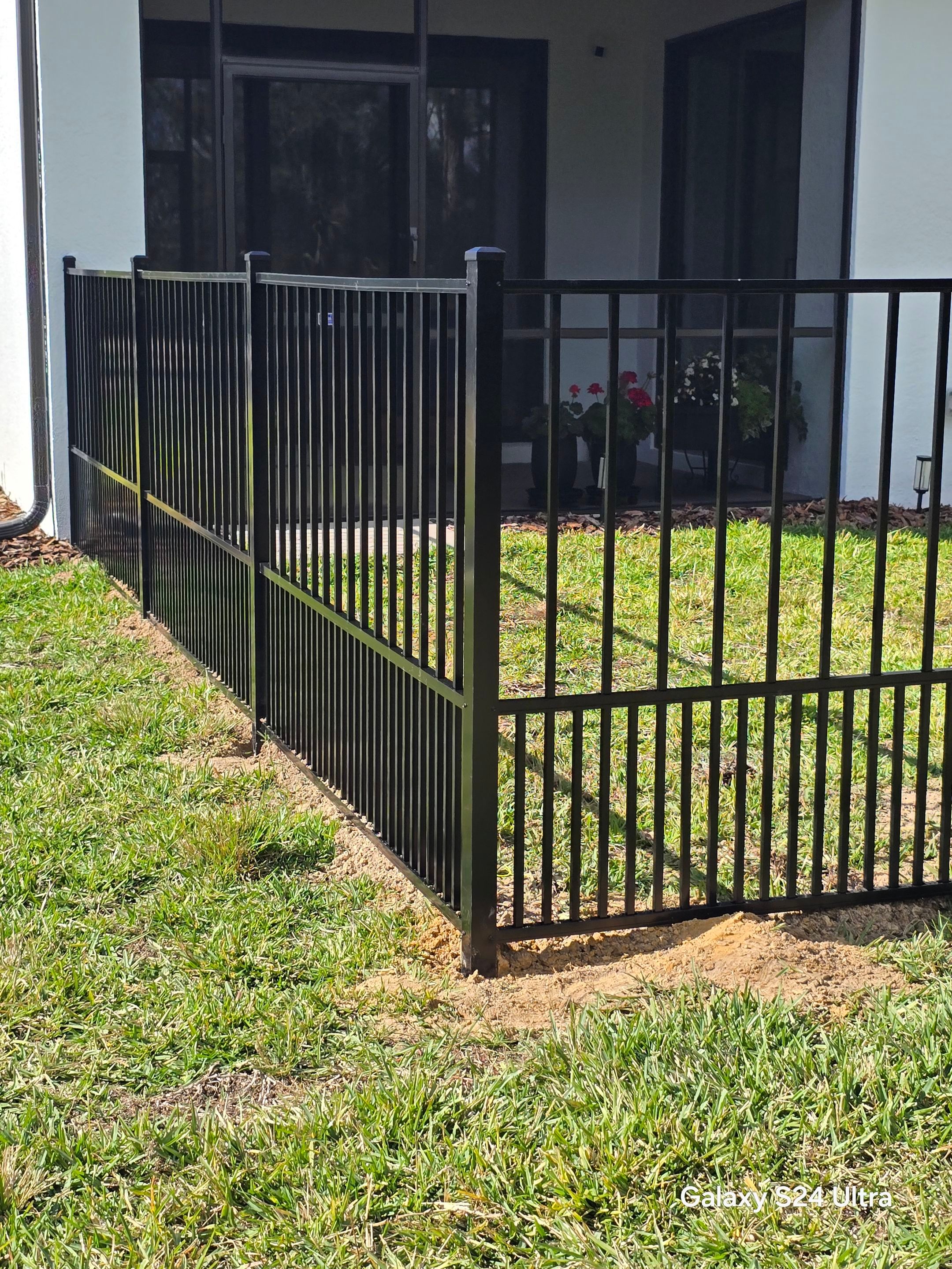 Puppy picket aluminum fence in North Port by True Fence LLC