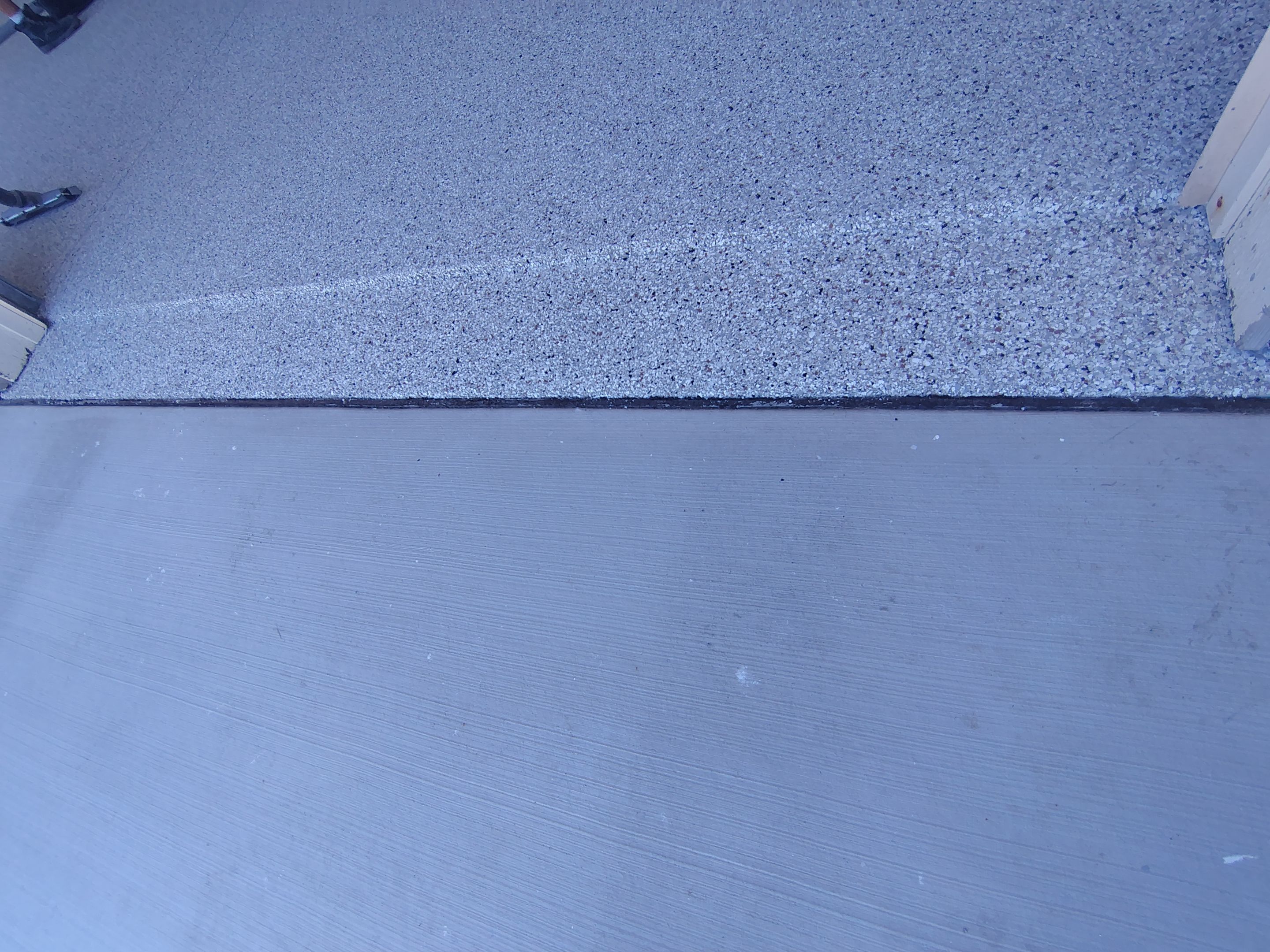 Custom Grey Speckled Epoxy Floor Coating for Sioux Falls Garage by Select Painting, Coatings & Garage Cabinets