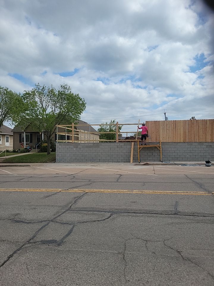 Cedar Fence using Cedar Pickets and Metal Poles by Clays Services Inc