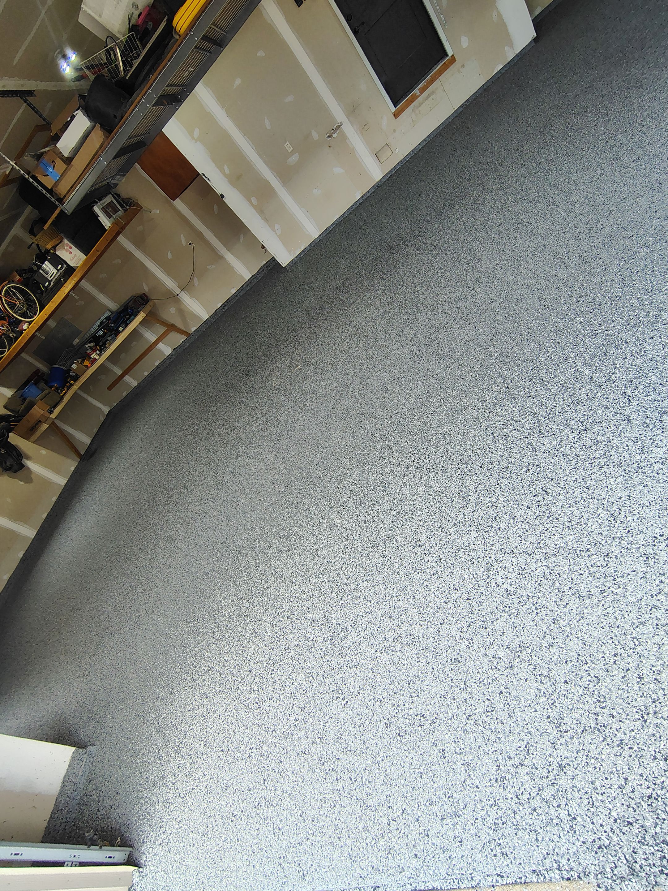 Sioux Falls Garage Concrete Grinding and Nightfall Decorative Chip Coating by Select Painting, Coatings & Garage Cabinets