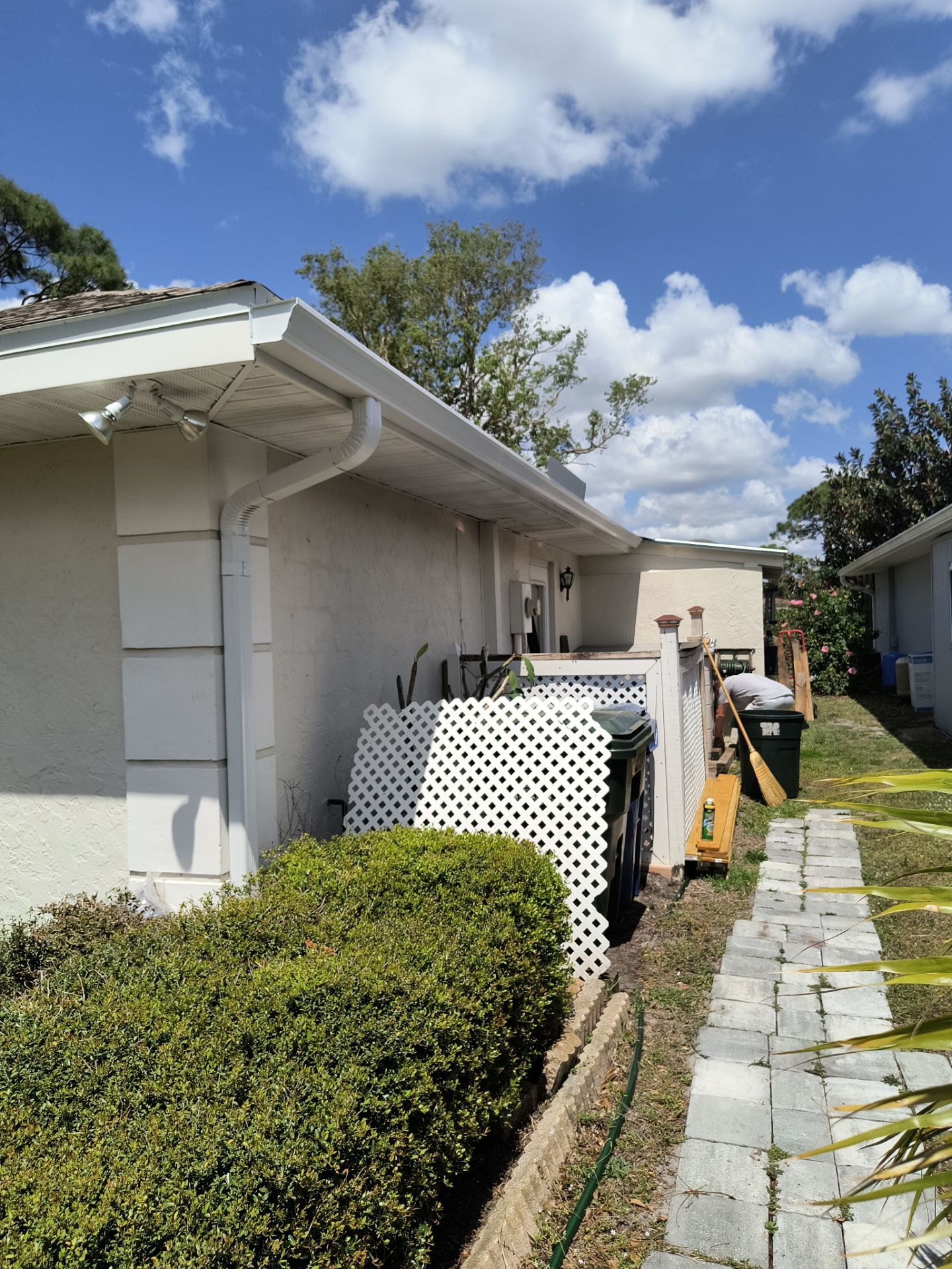 Gutter Project with White 6-K Seamless Gutters Installation and Downspouts in Sarasota FL by Gutter Professors