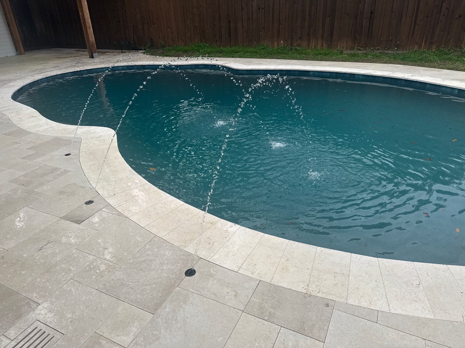 Freeform Pool Remodel with Travertine Deck and Deck Jets by Pinnacle Pools and Spas - DFW