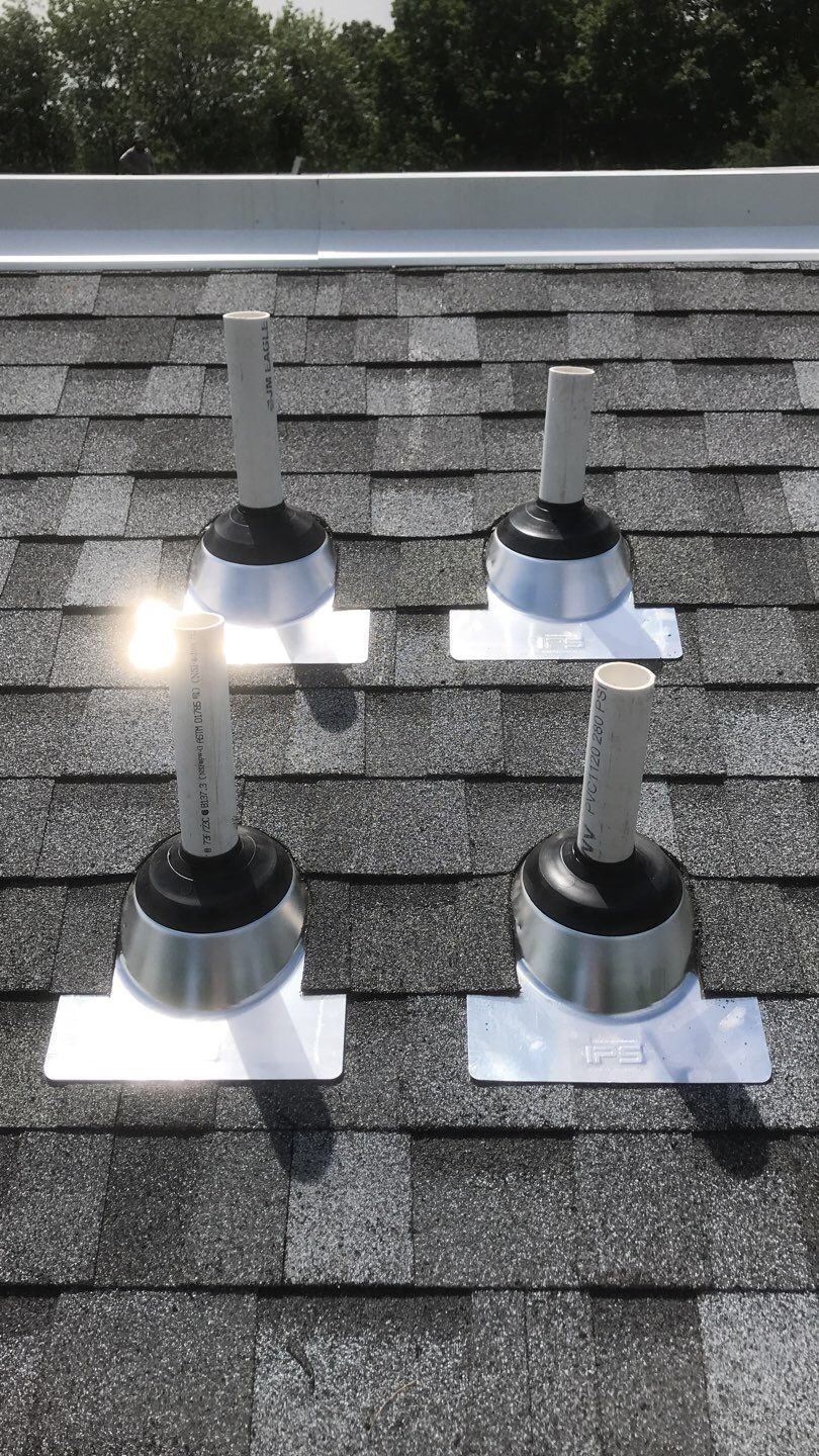 Commercial Roofing Installation using EPDM with white gutters by A Plus Exterior