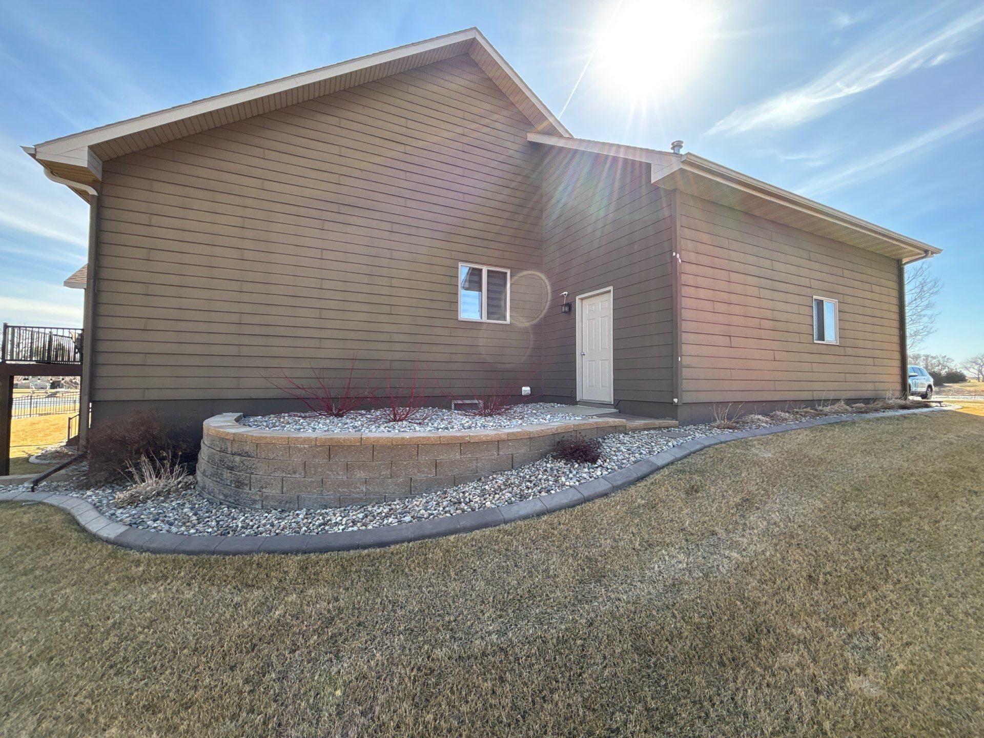 Full Exterior Renovation with Stone Veneer and Composite Decking by Select Painting, Coatings & Garage Cabinets