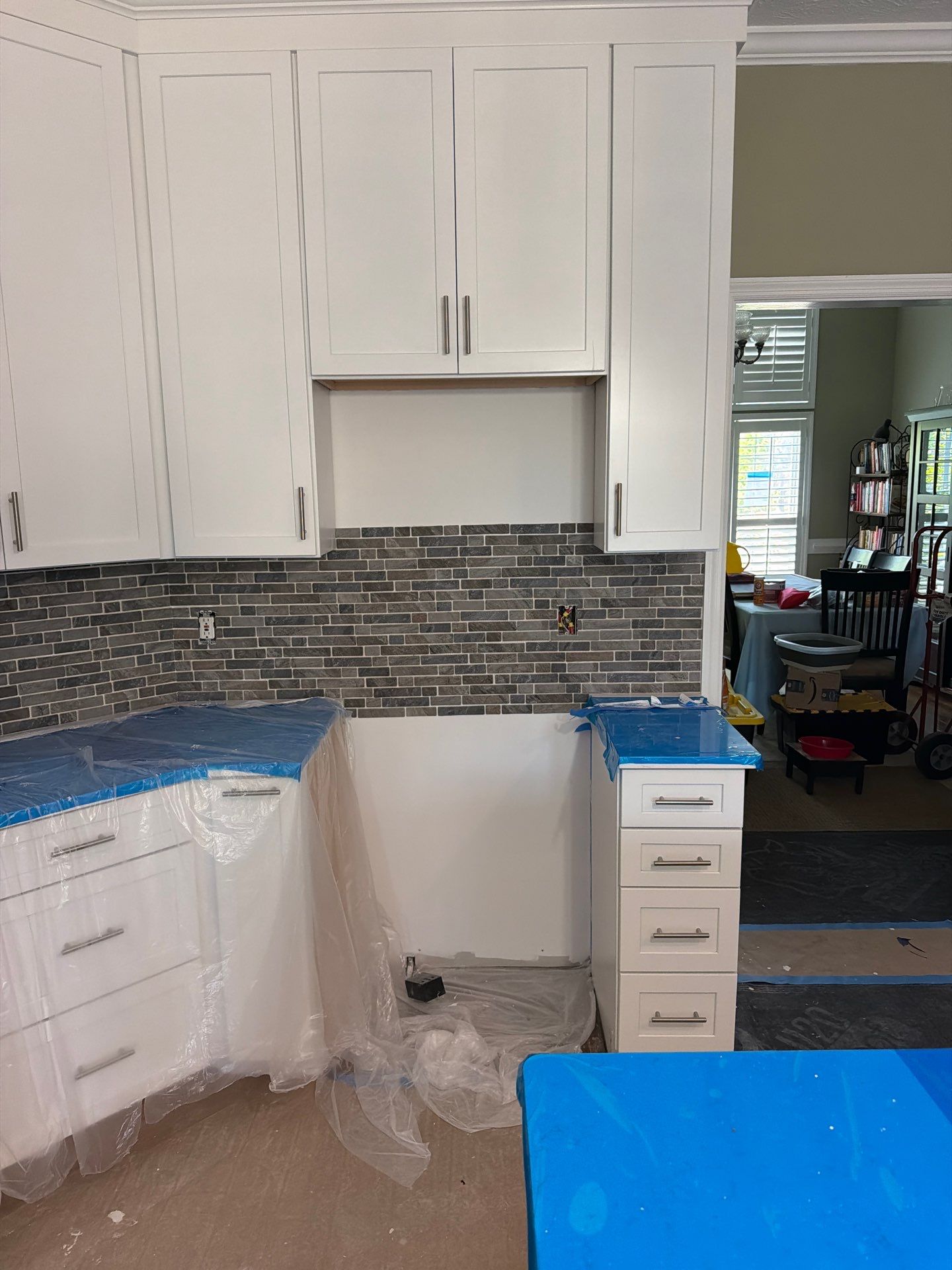 Complete Kitchen Renovation Featuring White Shaker Cabinetry in Fayetteville by Karcher Roofing & Construction