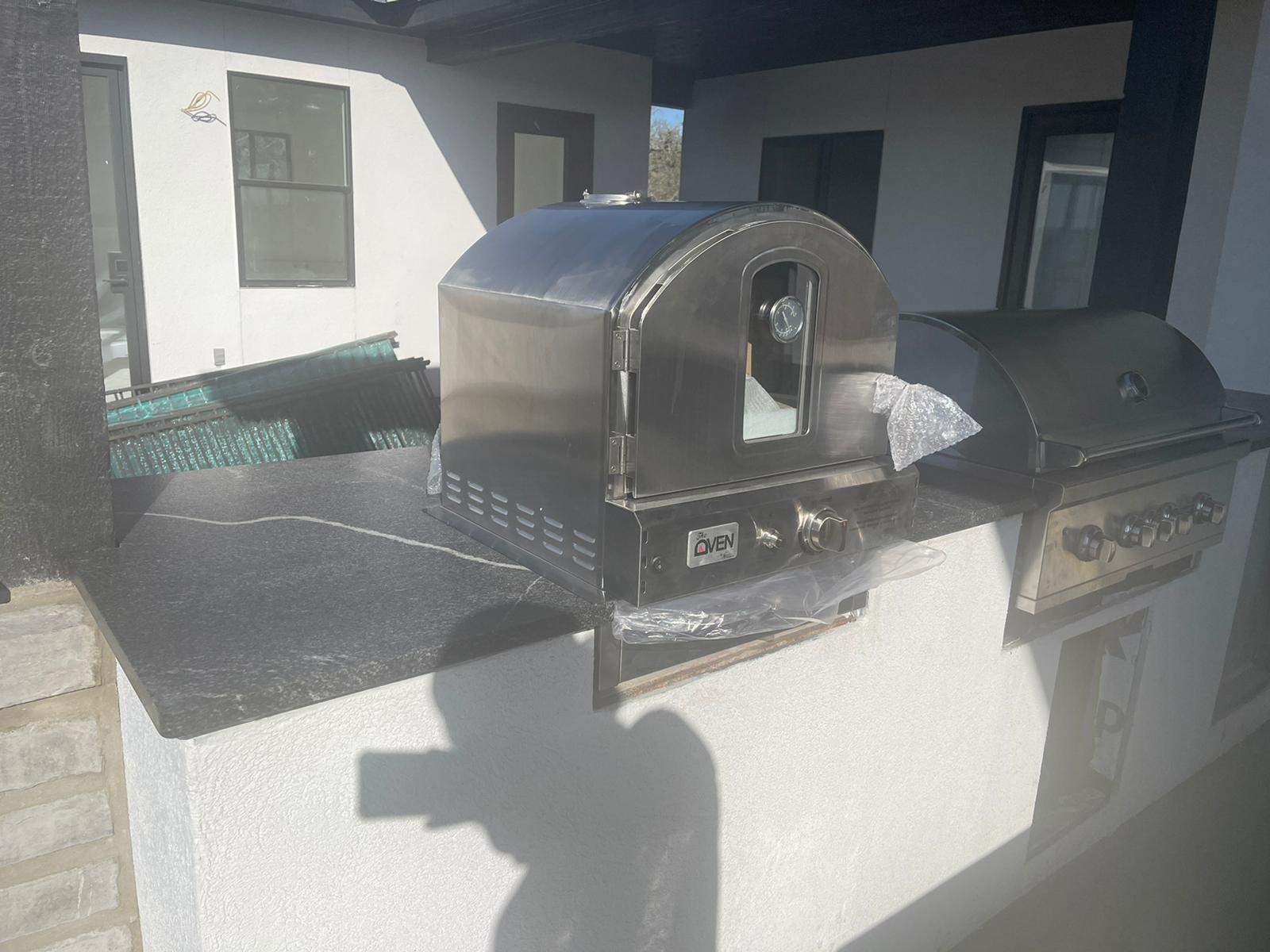 Outdoor kitchen using Black mist honed granite by Mena stone surfaces