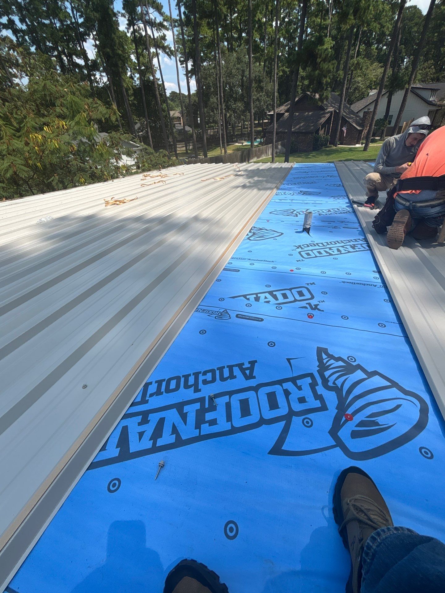White Standing Seam Metal Roof Replacement in Willis, Texas by Abbott Roofing Company