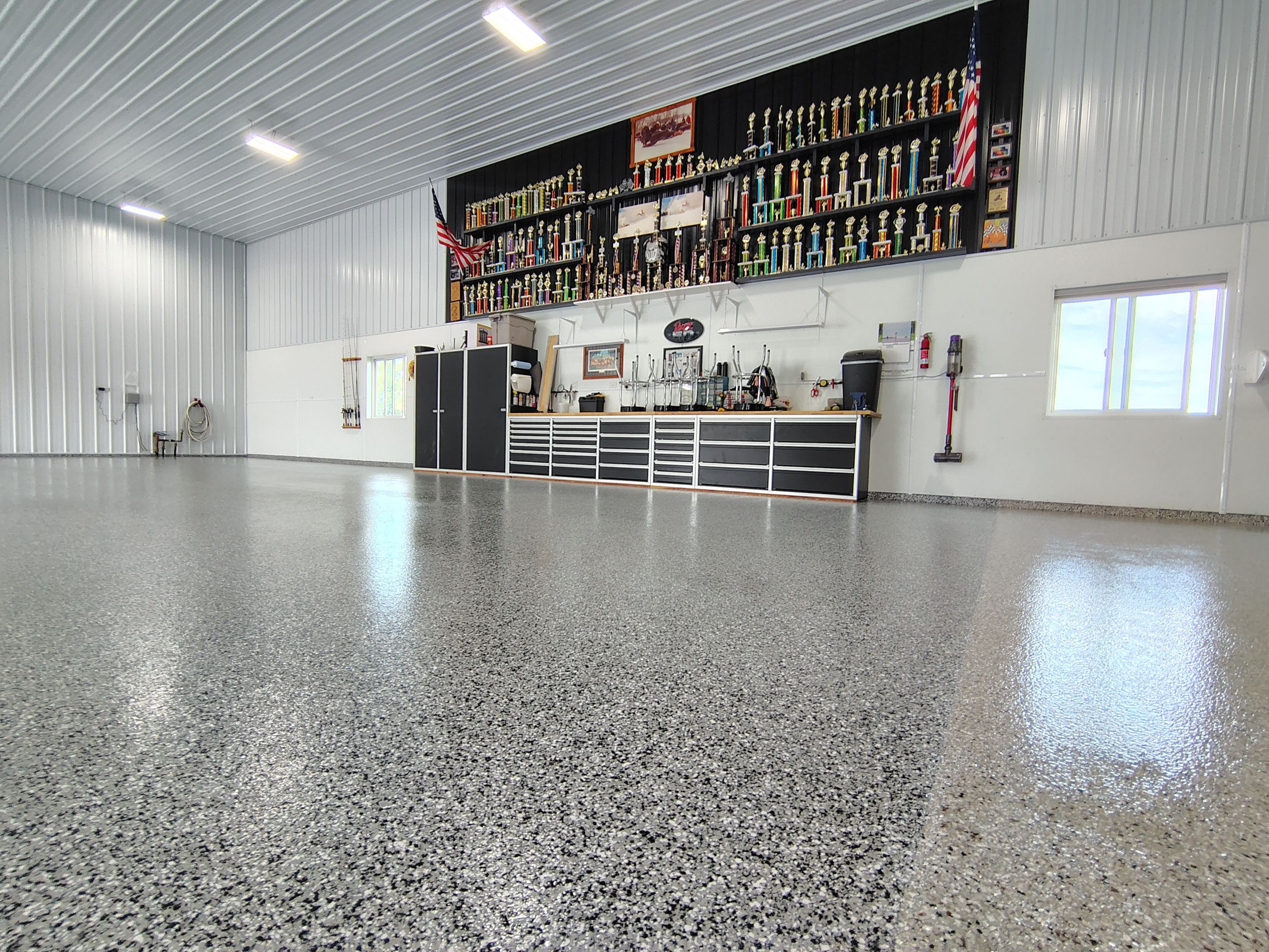 Multi-Stage Concrete Floor Coating for Egan Shop and RV Storage by Select Painting, Coatings & Garage Cabinets