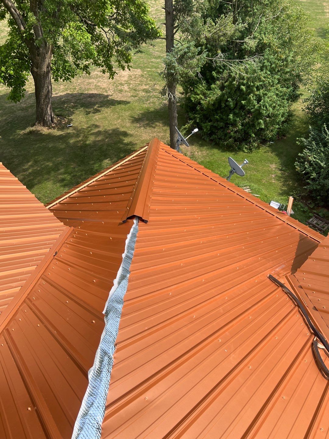 Residential Roofing Installation using Performance Panel Metal - Copper Metallic by RoofX 