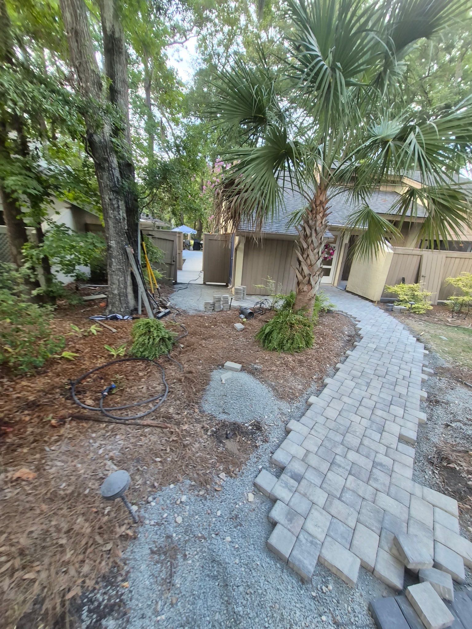 Custom Concrete Patio and Herringbone Paver Walkway in Hilton Head Island by Lowcountry Scapes, LLC
