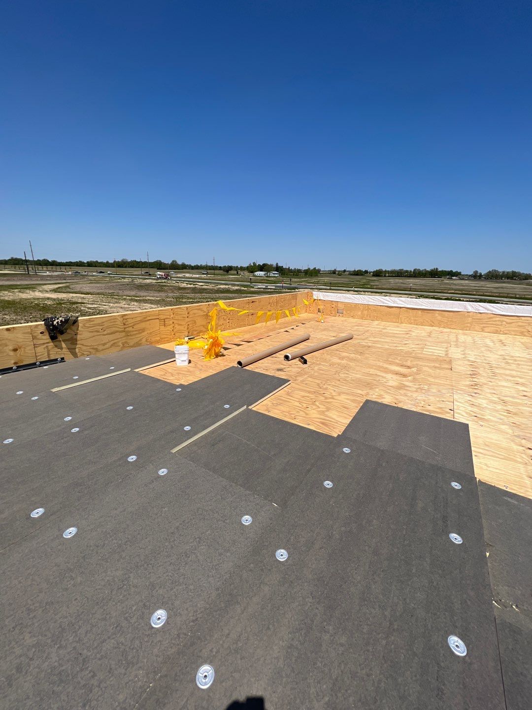 Commercial Roofing Installation using 60 mil rubber roof  by Nitro Roofing and Construction