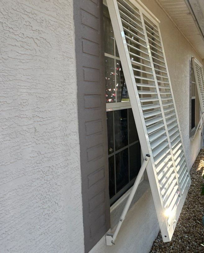 Hurricane Rated Bahama Shutters in Cream by Smart Guard Shutters