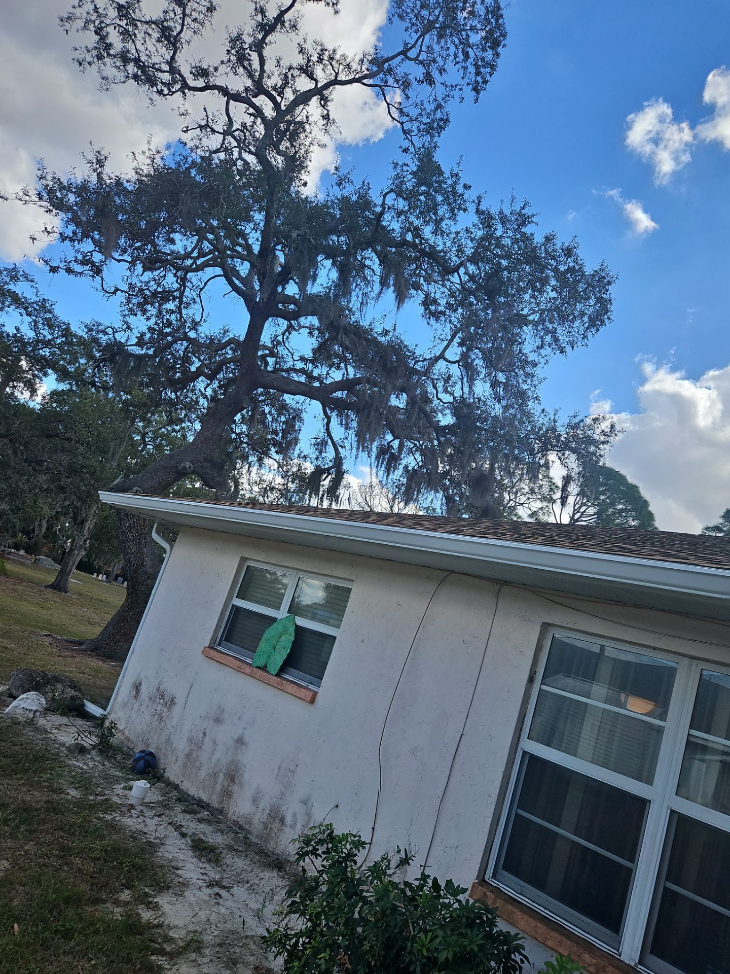 Downspout Installation using White Down Spouts in Sarasota FL by Gutter Professors