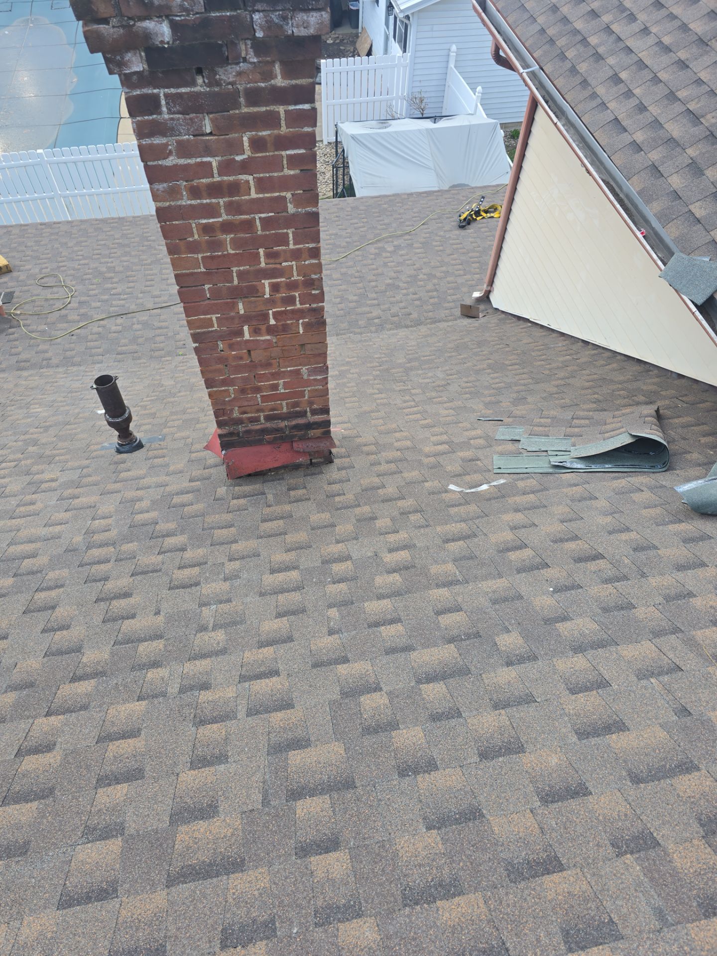 Residential Roofing Installation using GAF Timberline HDZ Charcoal by Rainstoppers Roofing