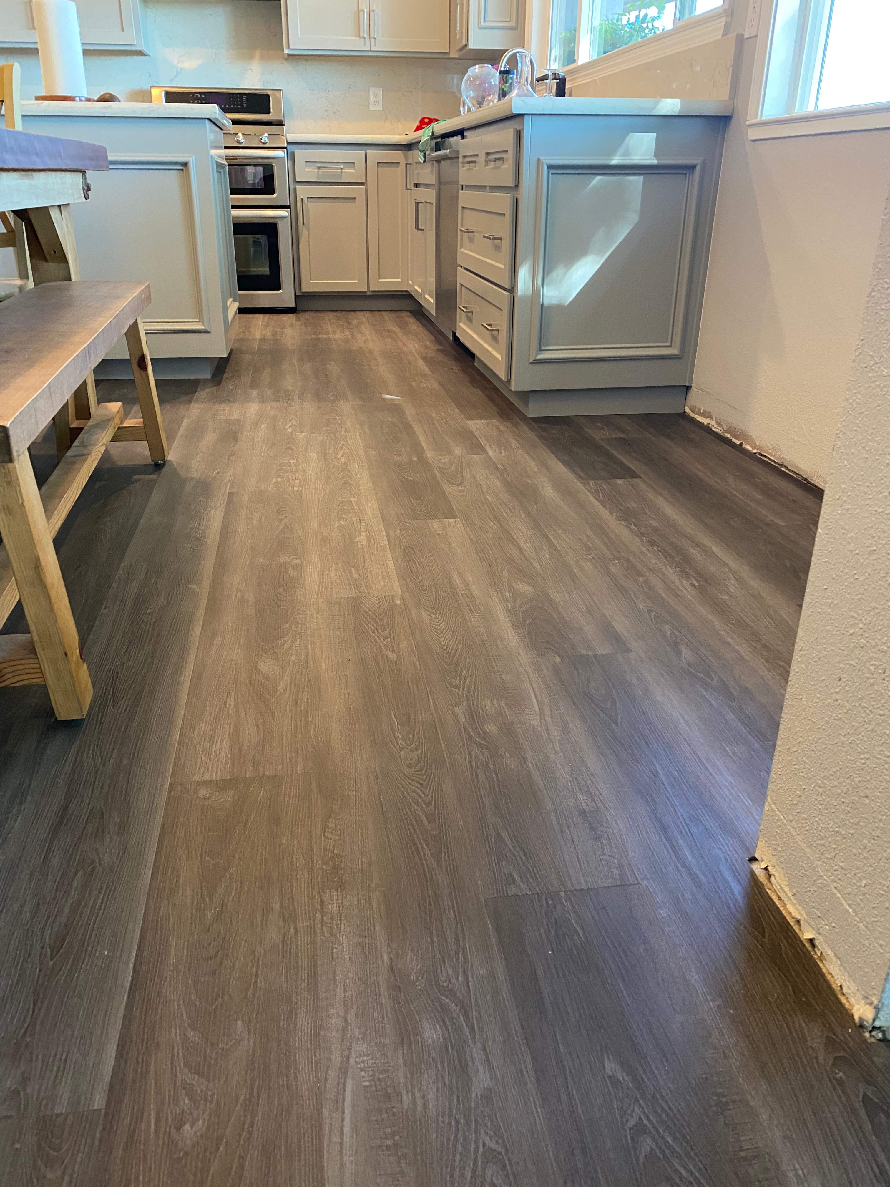 LVP Flooring for newly remodeled kitchen in Newcastle. by Footprints Floors South Sacramento
