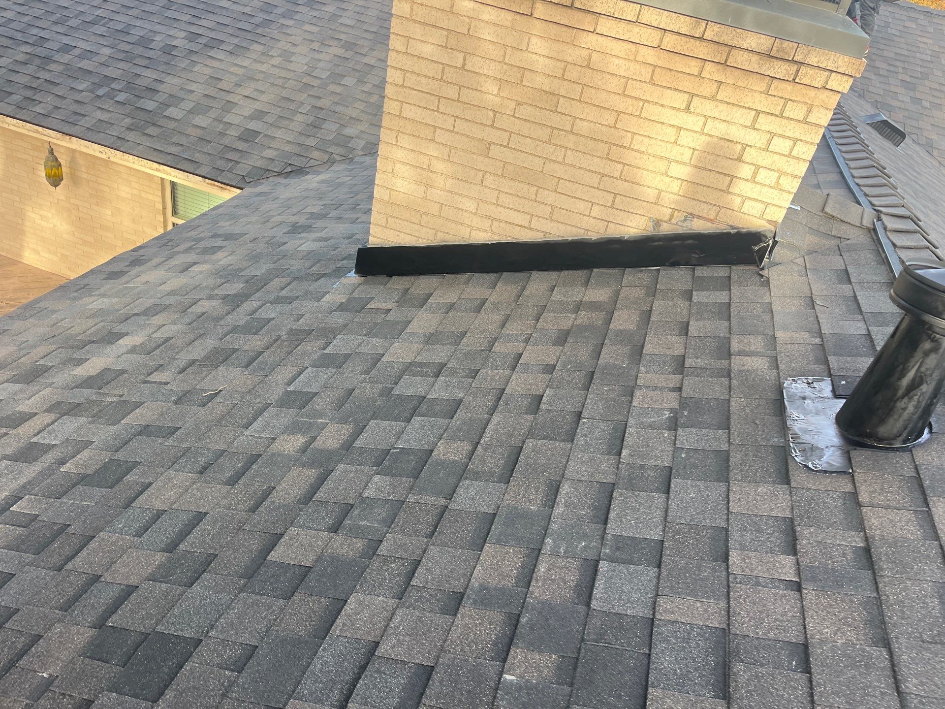 IKO Brownstone- White Brick  by Tejas Roofworks + Restoration