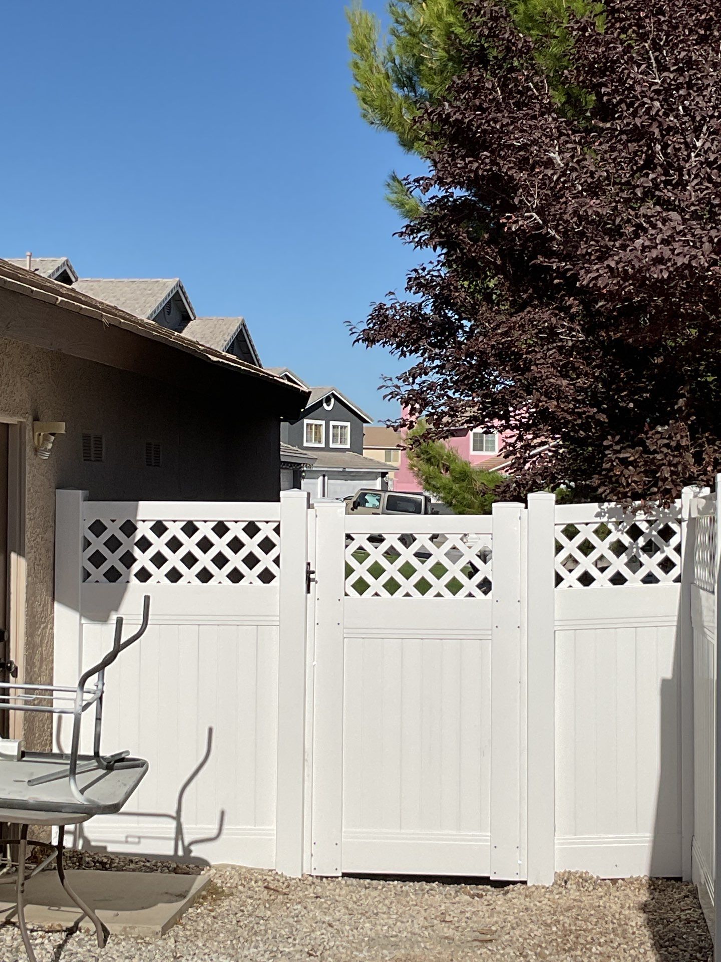Lattice Vinyl with Privacy Vinyl Fence by Fence Guys Inc.