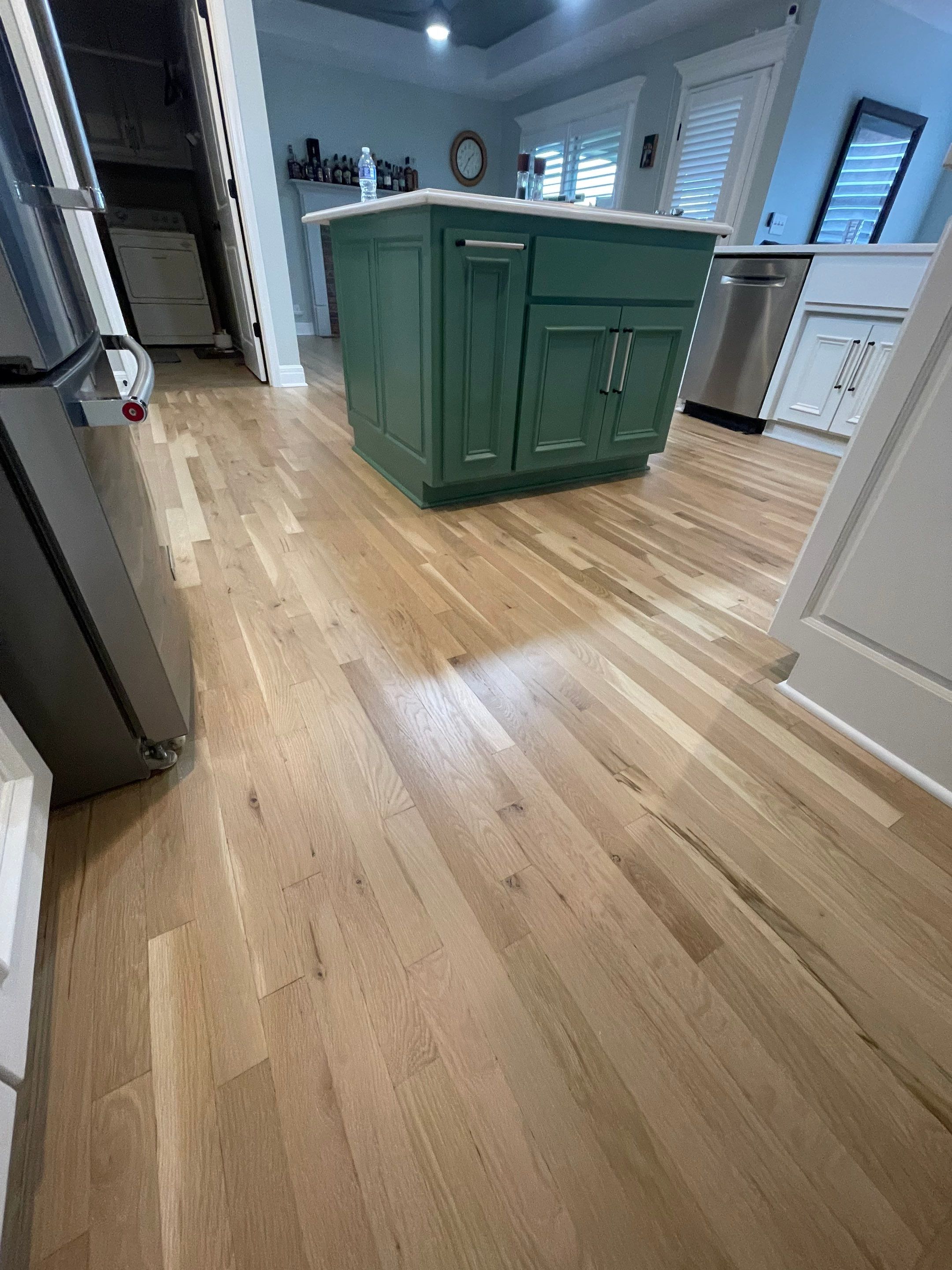 Hardwood Flooring Installation and Baseboard Trim in Grain Valley by Rippnfinish