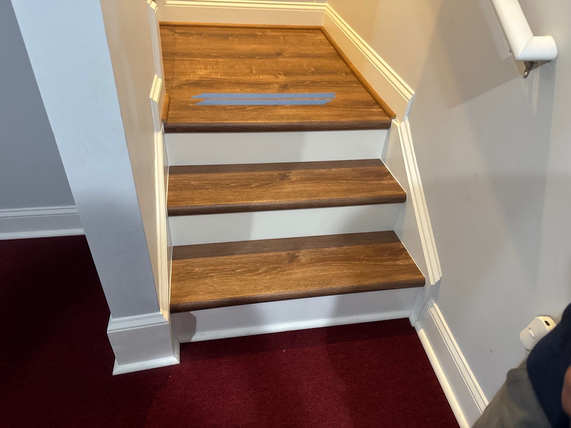 Stairway Installation using t vinyl stair tread and reversibleriser by La Bendicion Contruction Llc