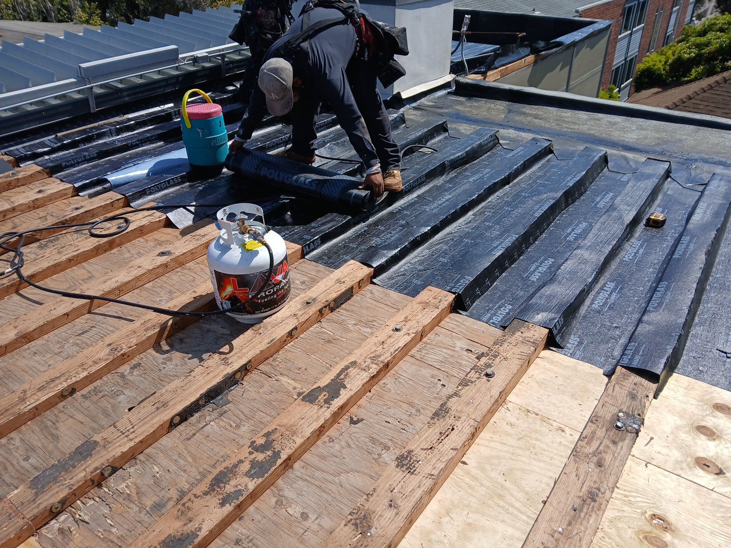 Residential Roofing Installation using Polyglass Torch Down Roofing System by Hull Brothers Roofing