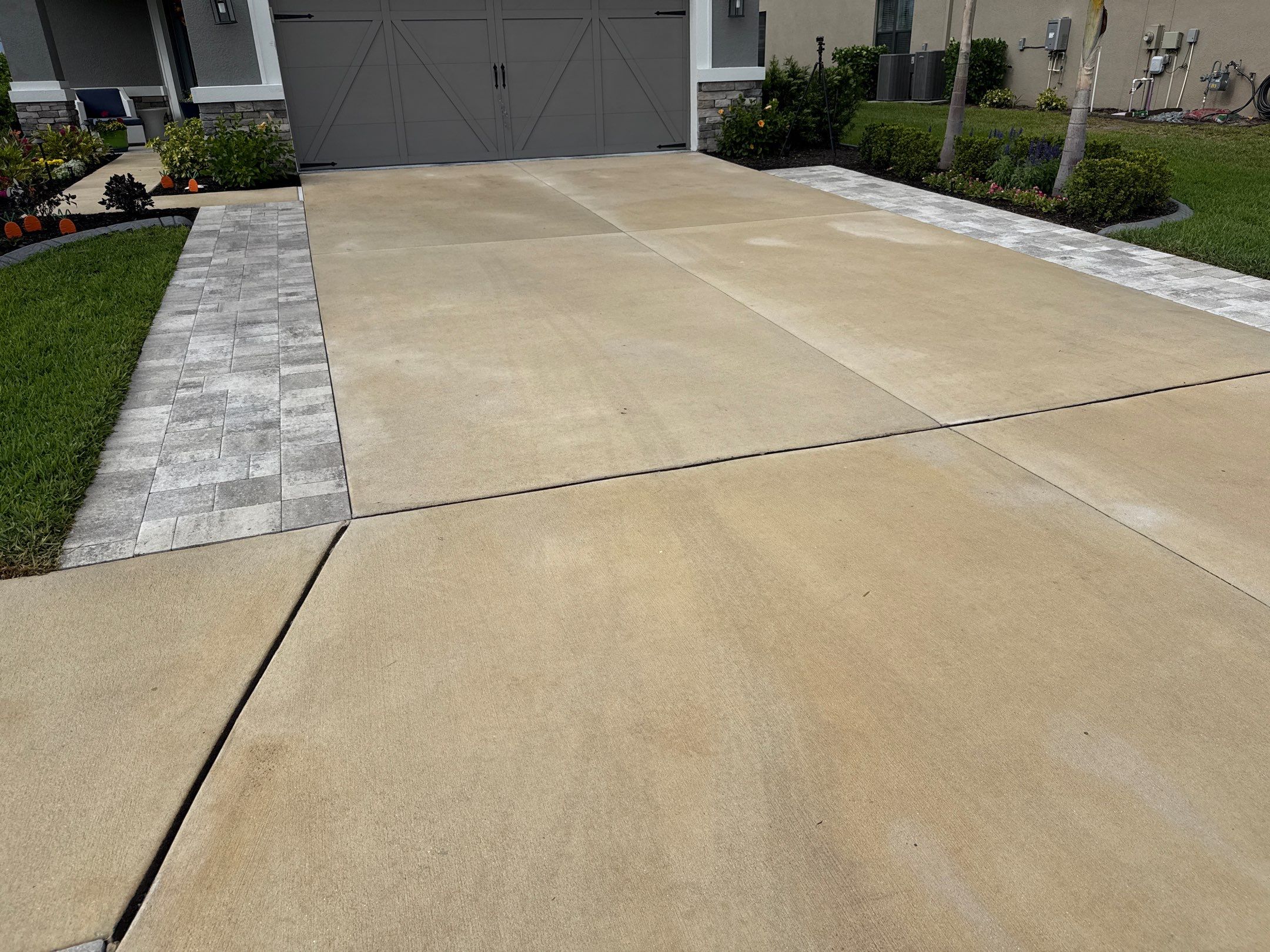 Rust Stain Removal from Concrete Driveway and Pavers in Park East at Azario | Lakewood Ranch, FL by Sunshine AquaWash