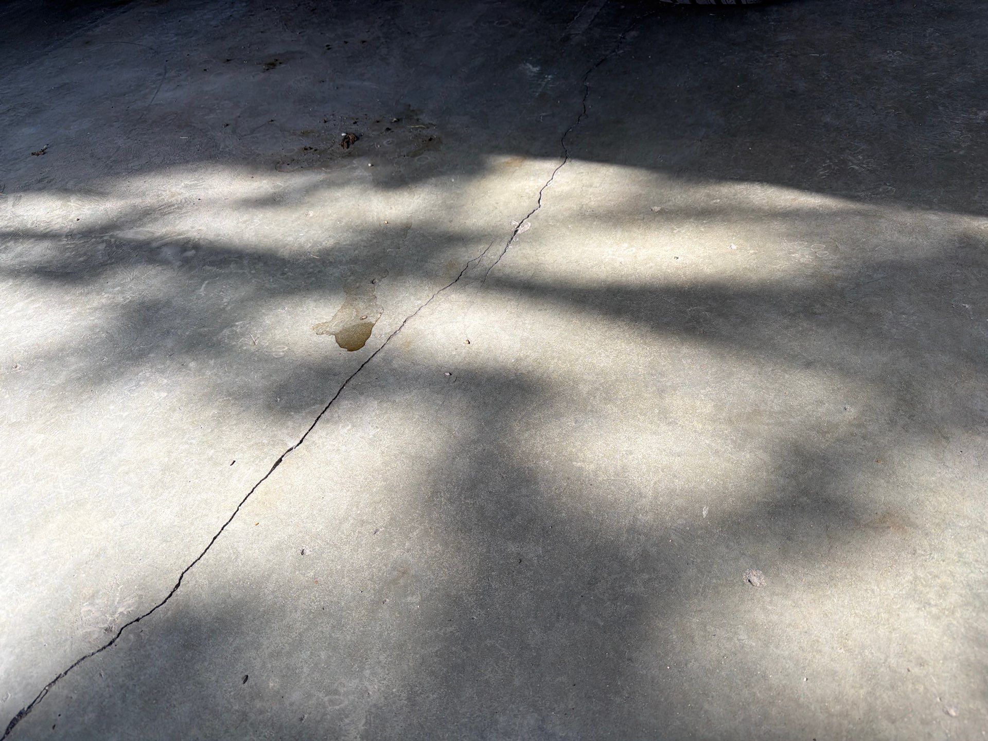 Residential Garage Floor Coating with Feather Grey Finish in Sioux Falls by Select Painting, Coatings & Garage Cabinets